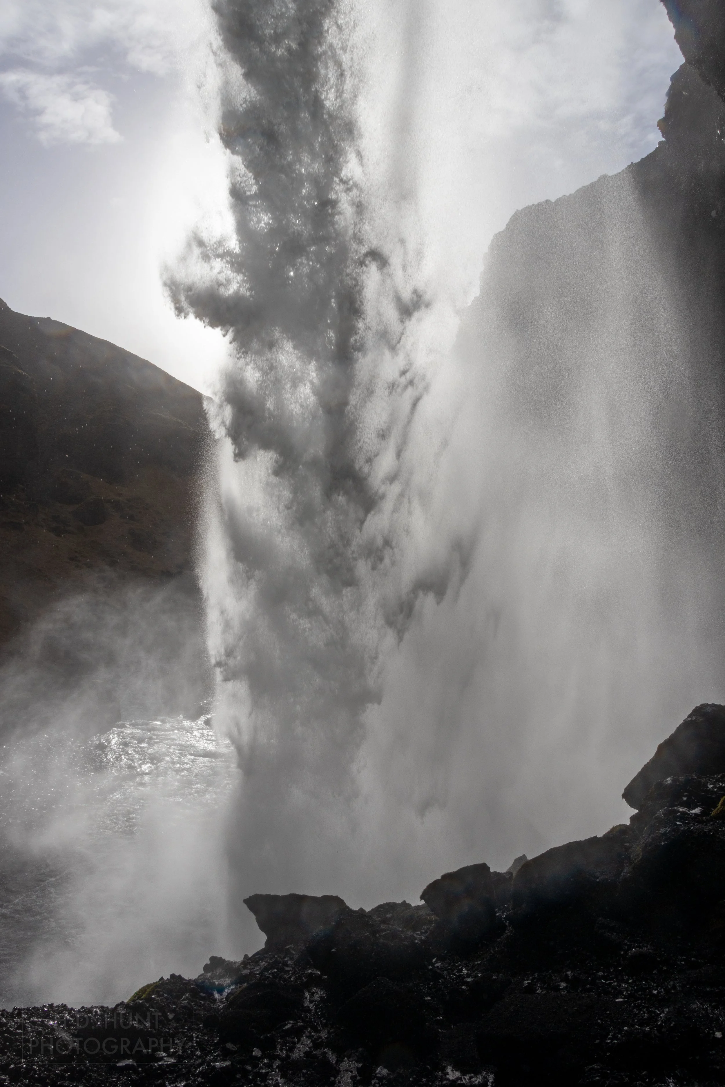 A waterfall seen from behind the main water drop, Kvernufoss, Iceland.