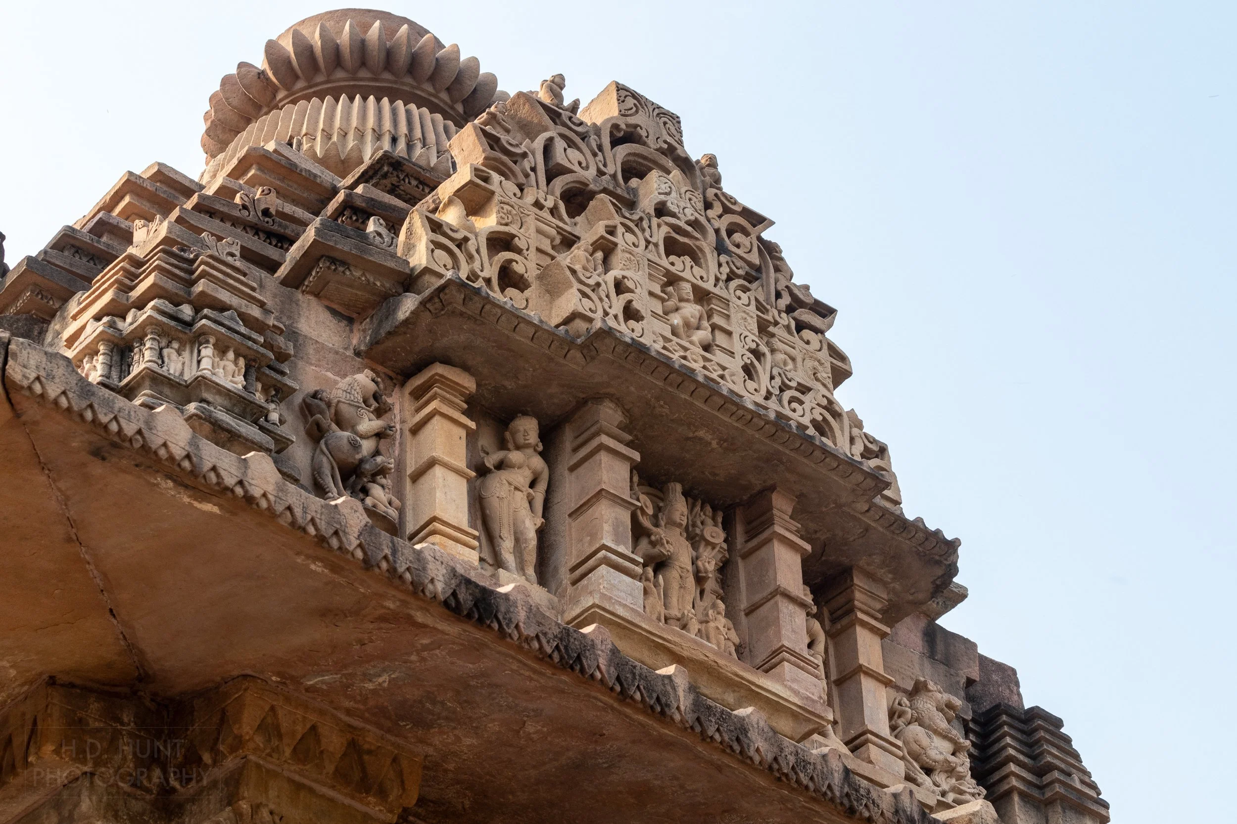 Close-up of the stone carvings adoring the Lakshmana Temple, Khajuraho Group of Monuments, India.