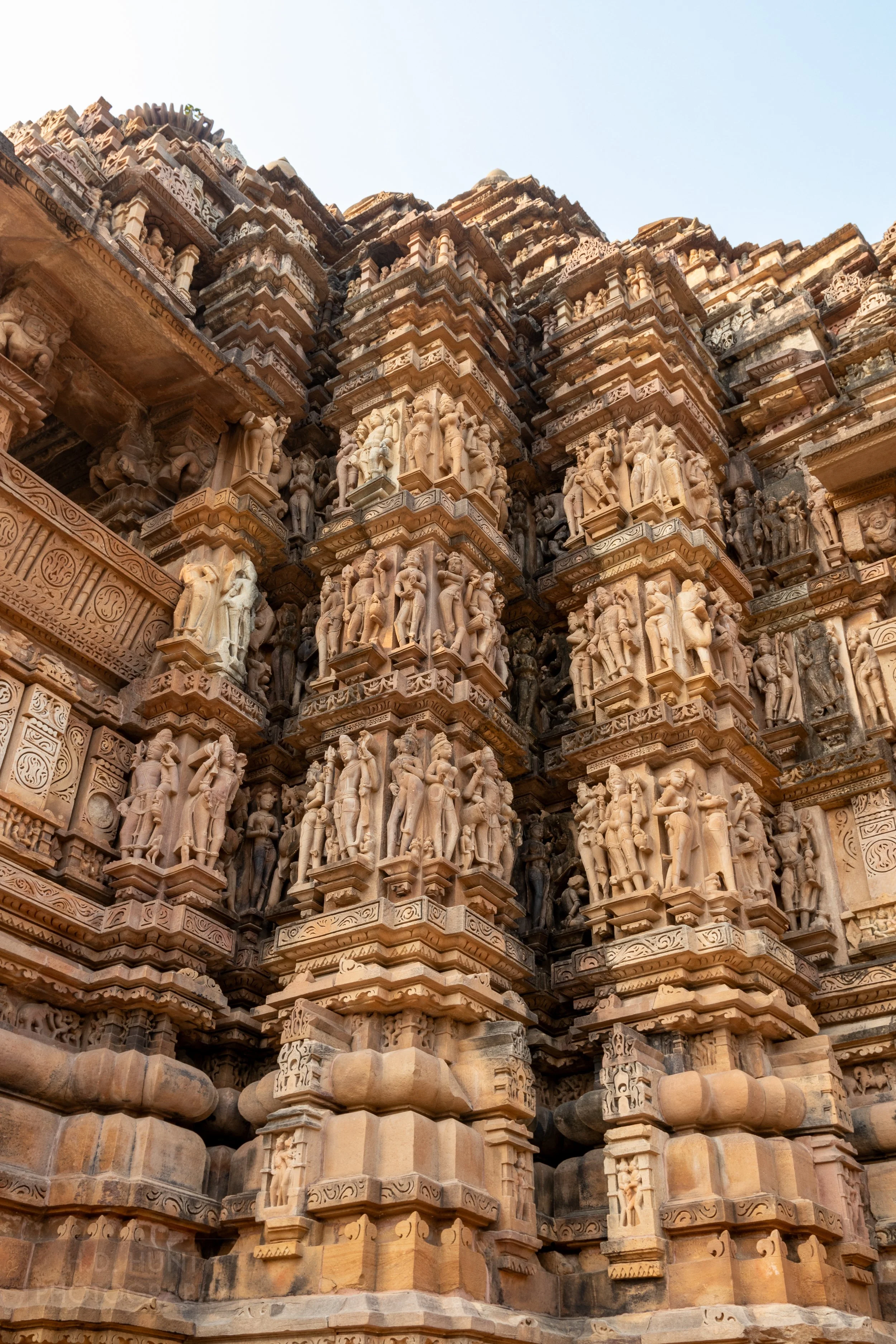 Close-up of the stone carvings adoring Kandariya Mahadeva, Khajuraho Group of Monuments, India.