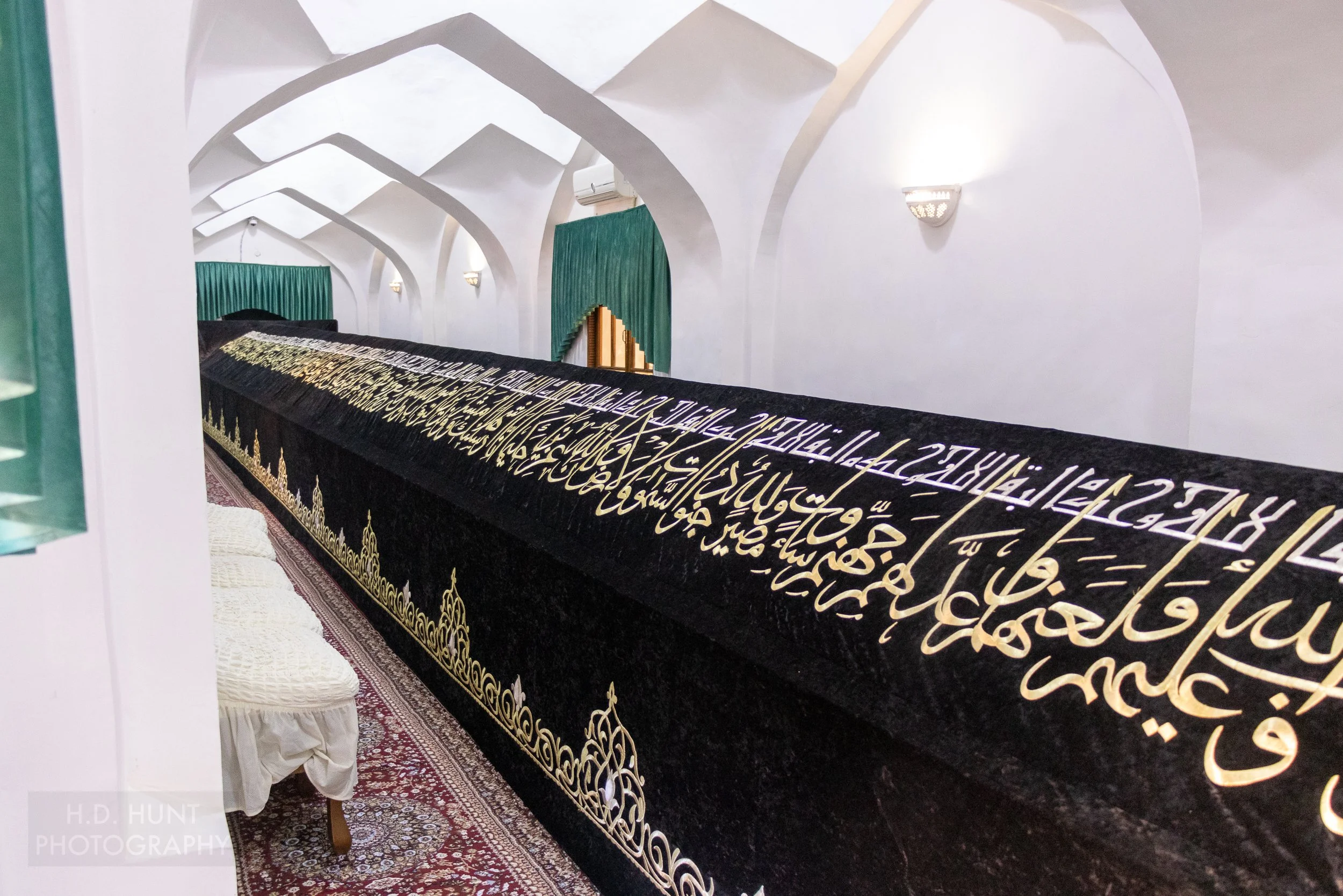 The gigantic sarcophagus of Khoja Doniyor - Daniel from the Bible - rests in a long white room in Samarkand, Uzbekistan.