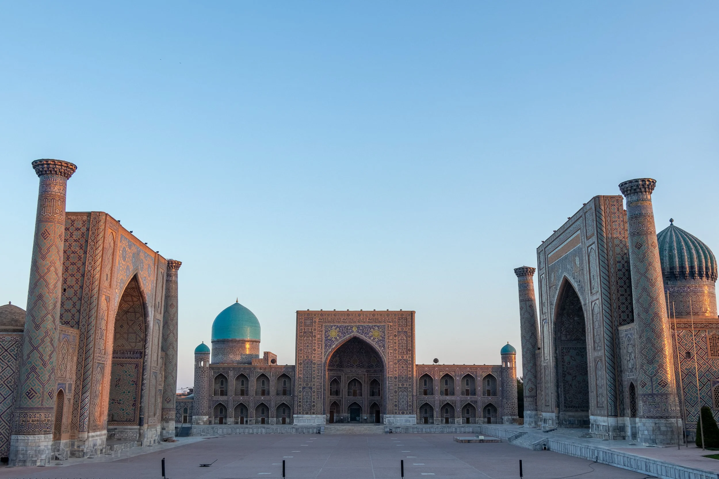 The Registan square illuminated at sunrise, Samarkand, Uzbekistan.