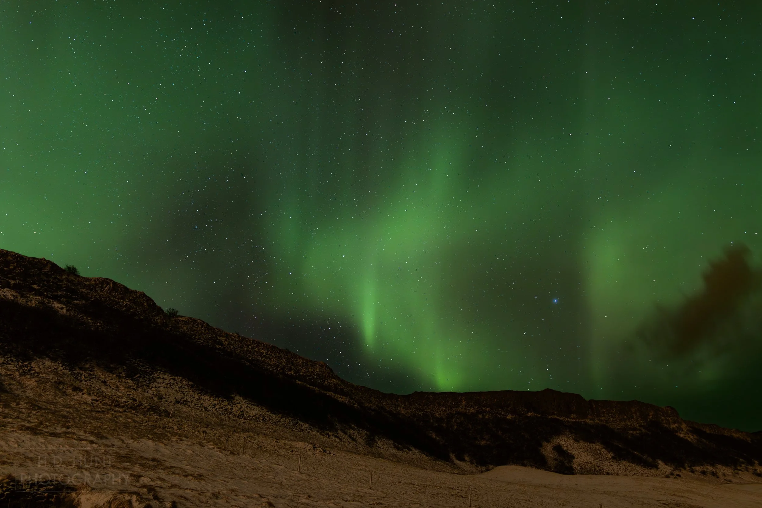 The green light of Aurora Borealis - the Northern Lights - is seen north of Reykholt í Biskupstungum, Iceland.