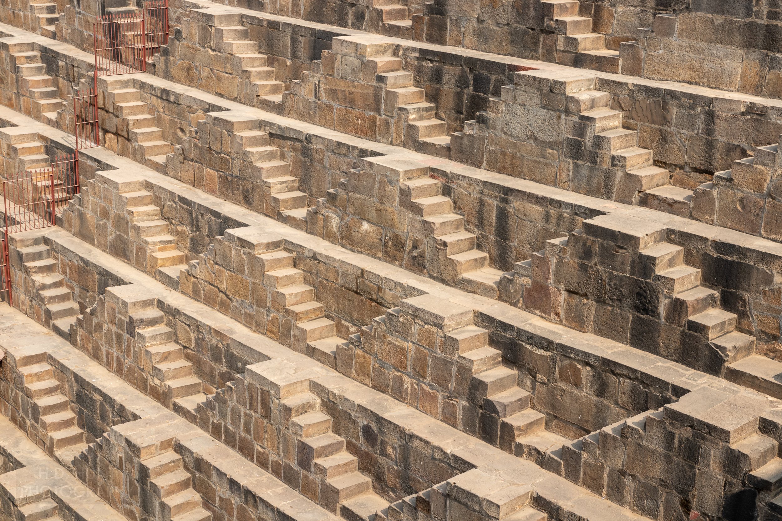 The zig-zag tan stone steps of Chand Baori, Abhaneri, India.