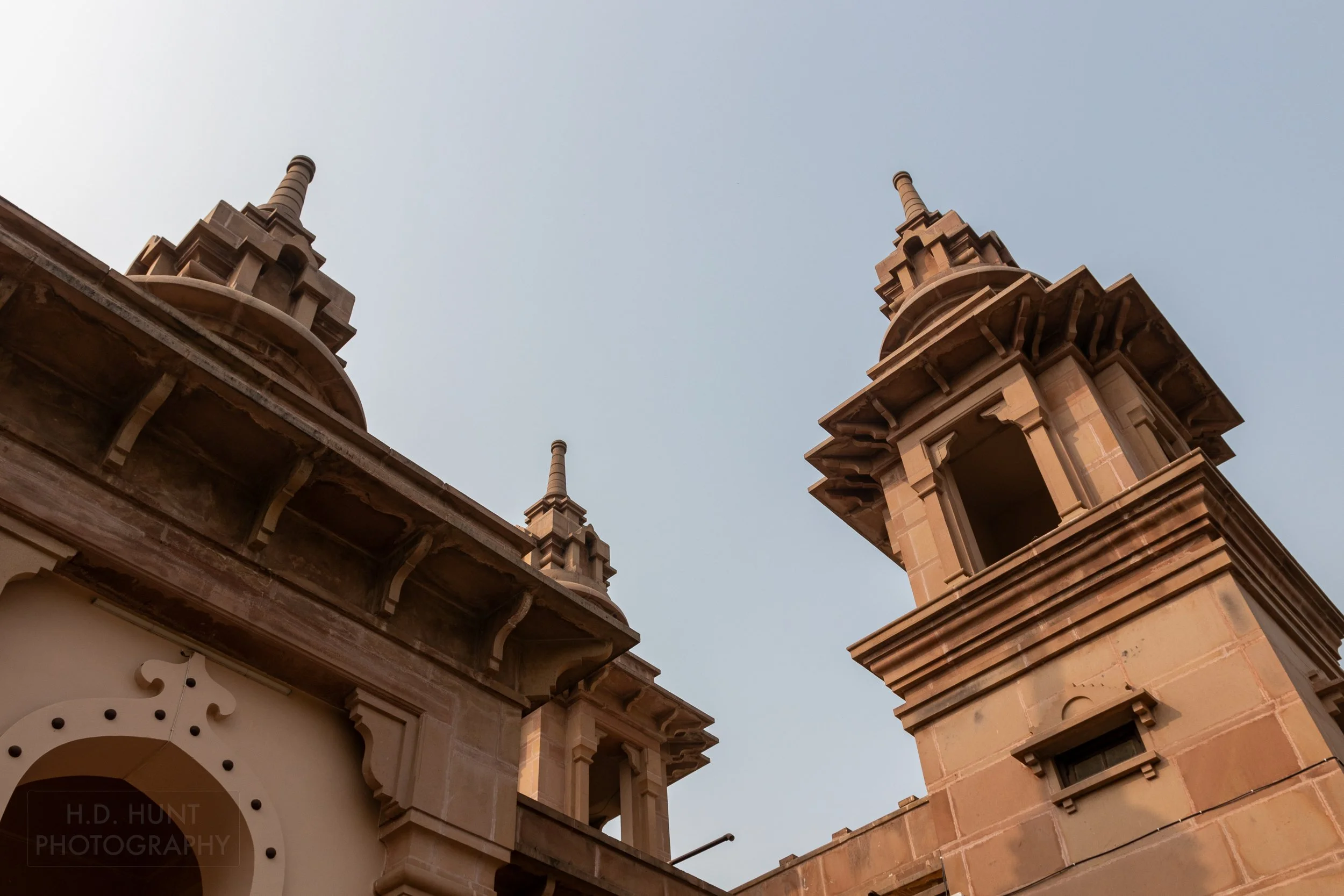 Three stone towers rise, Varanasi, India.