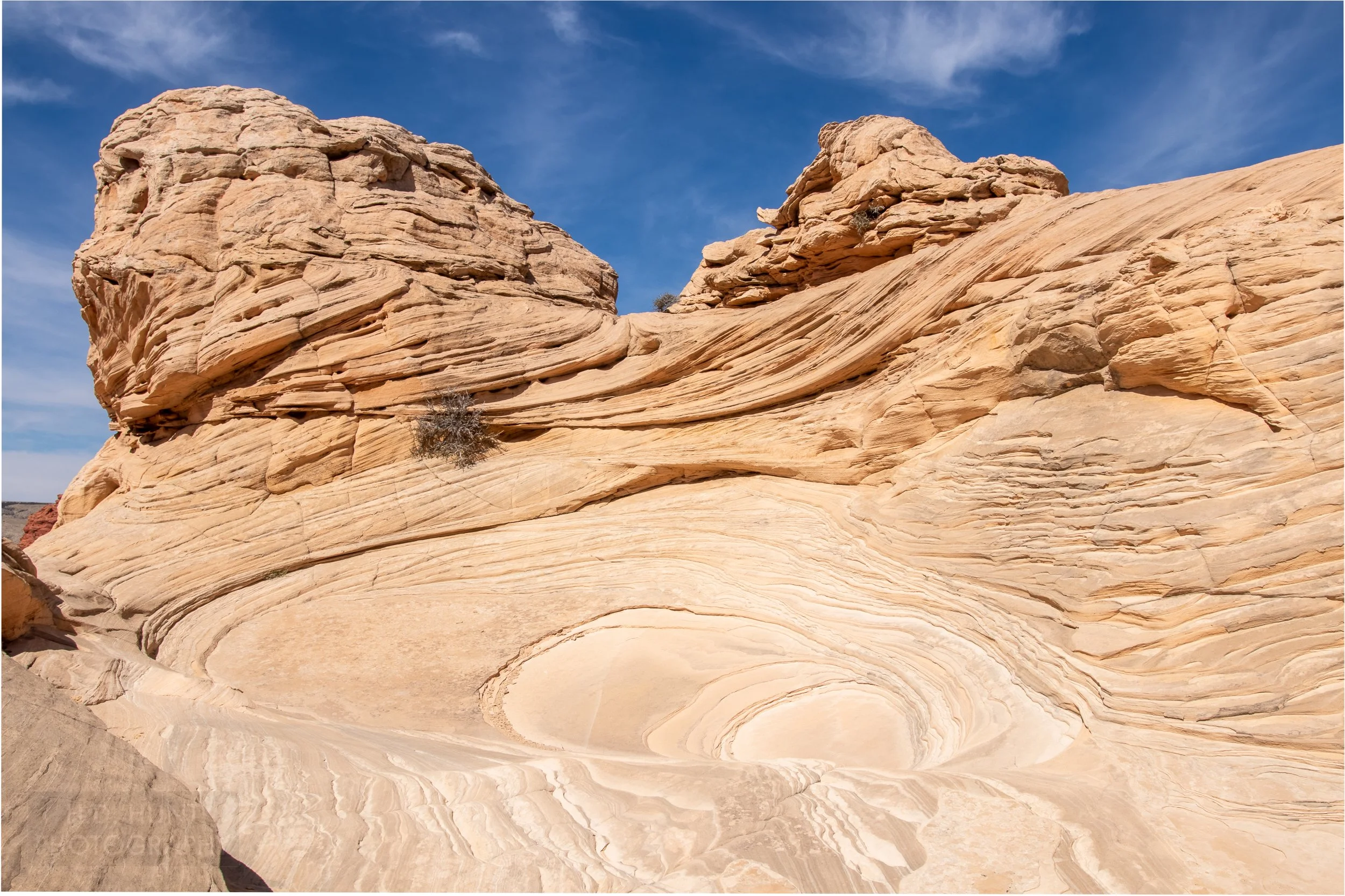 Heavily striped white sandstone cliffs are seen in Coyote Buttes North, Paria Canyon-Vermilion Cliffs Wilderness, Arizona, United States.