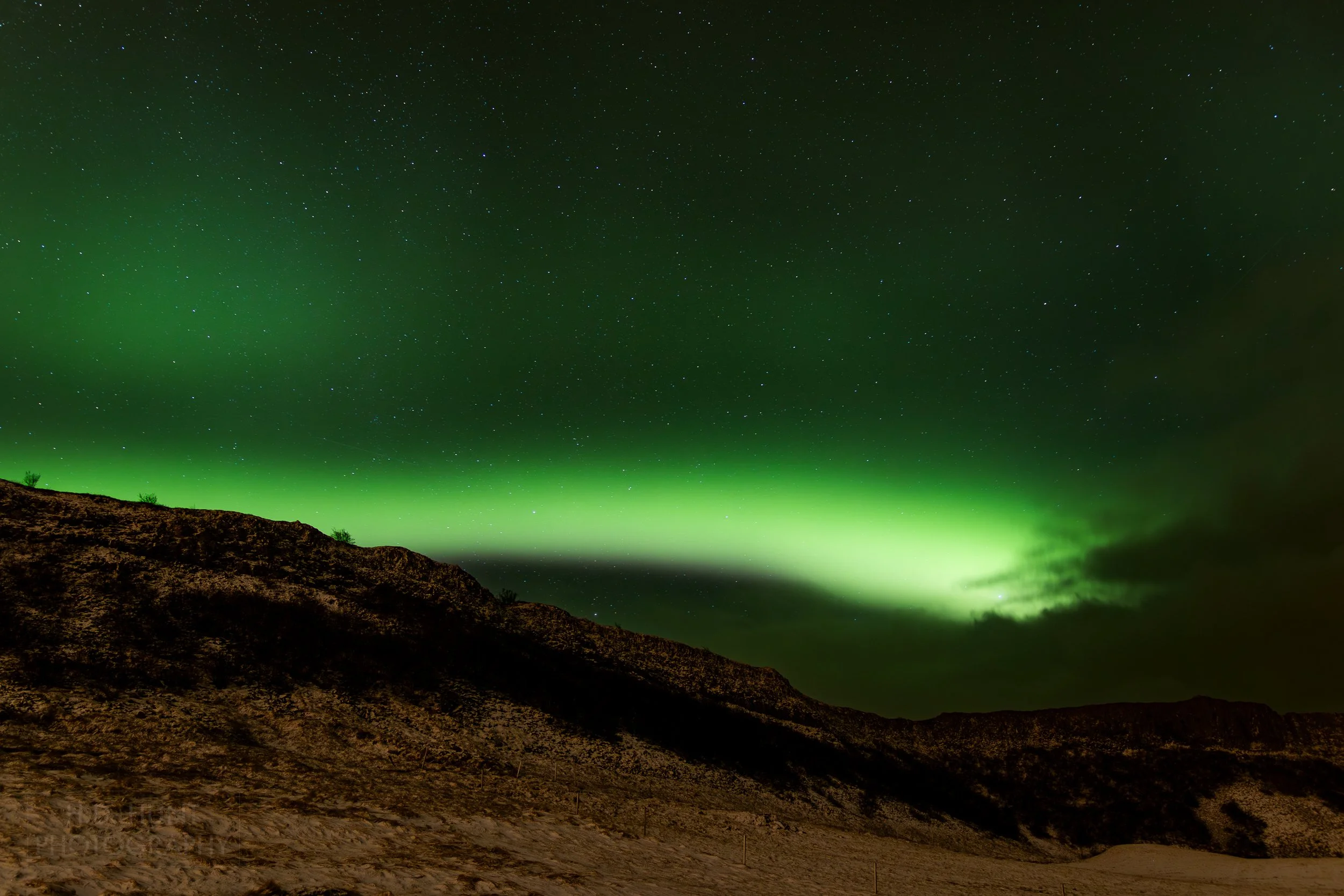 The green light of Aurora Borealis - the Northern Lights - is seen north of Reykholt í Biskupstungum, Iceland.