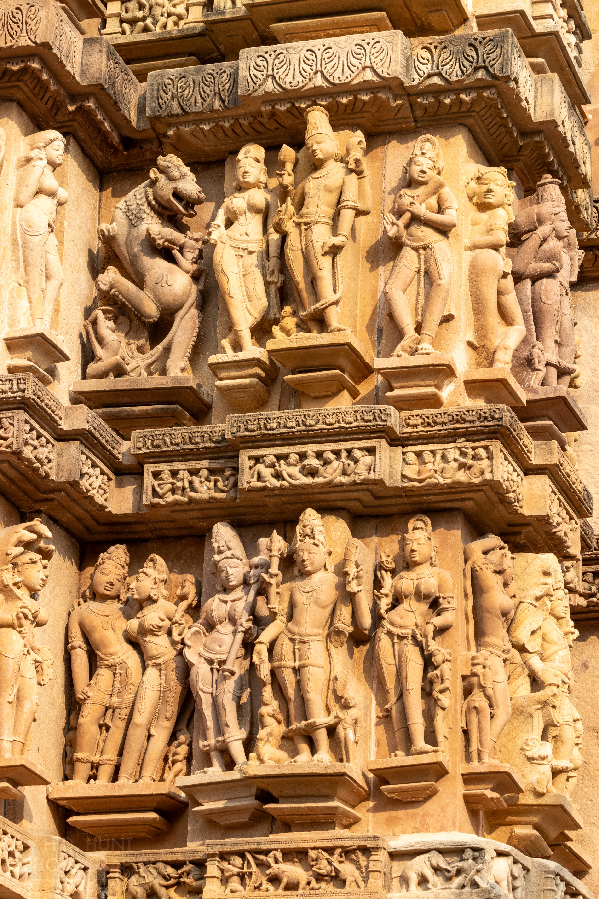 Close-up of the stone carvings adoring the Lakshmana Temple, Khajuraho Group of Monuments, India.