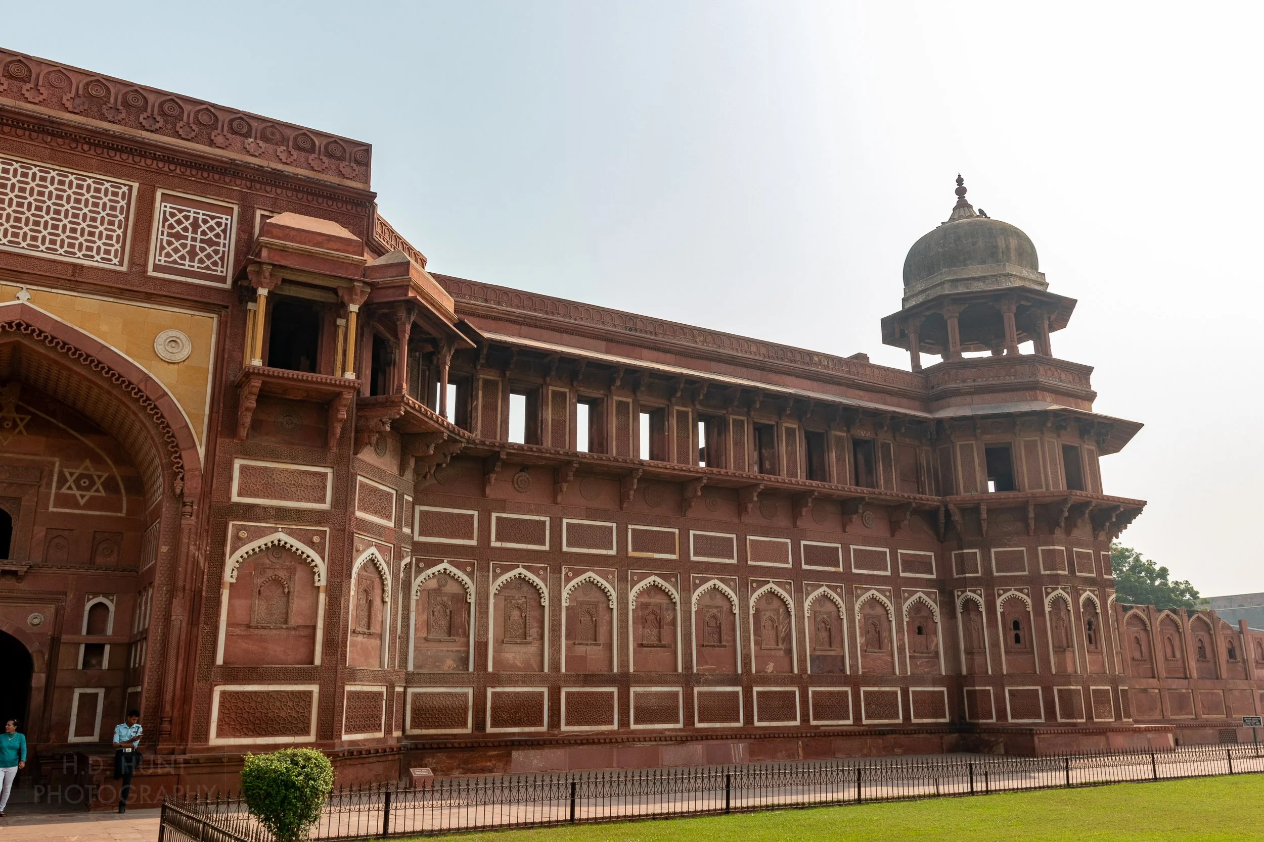 The large red and white stone exterior wall of Agra Fort, Agra, India.
