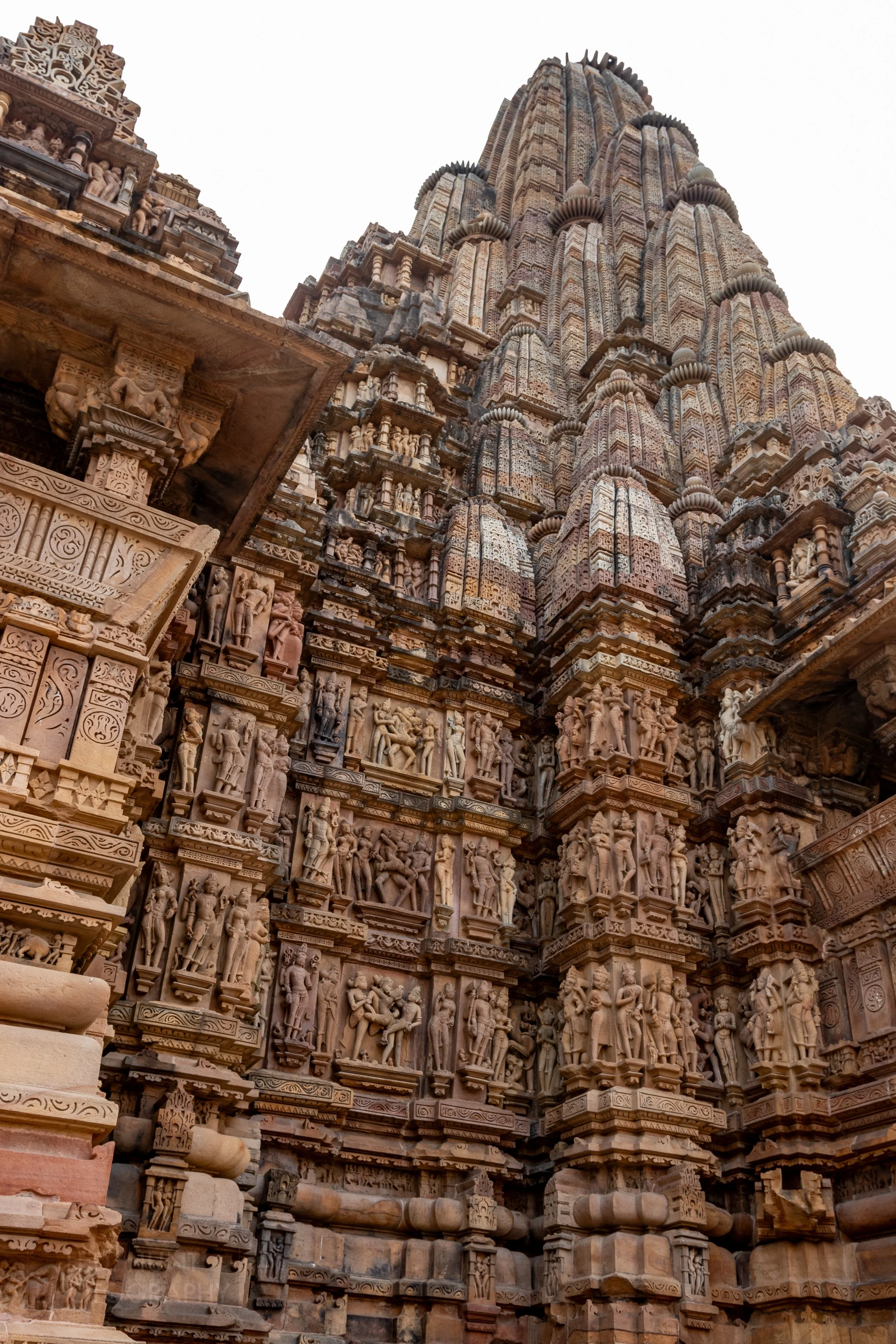Close-up of the stone carvings adoring Kandariya Mahadeva, Khajuraho Group of Monuments, India.