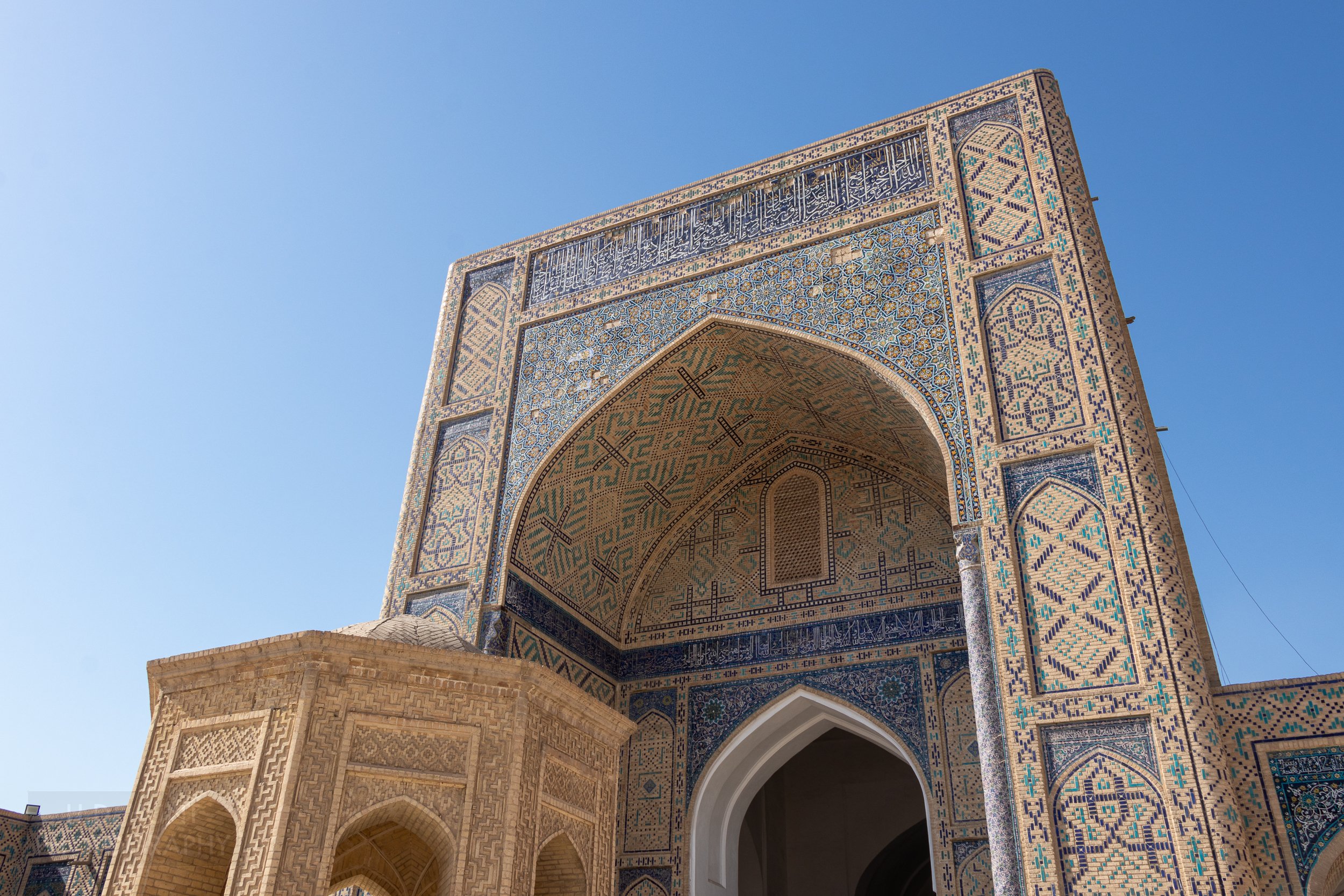 An ornately-tiled iwan inside the Kalan Mosque, Bukhara, Uzbekistan.