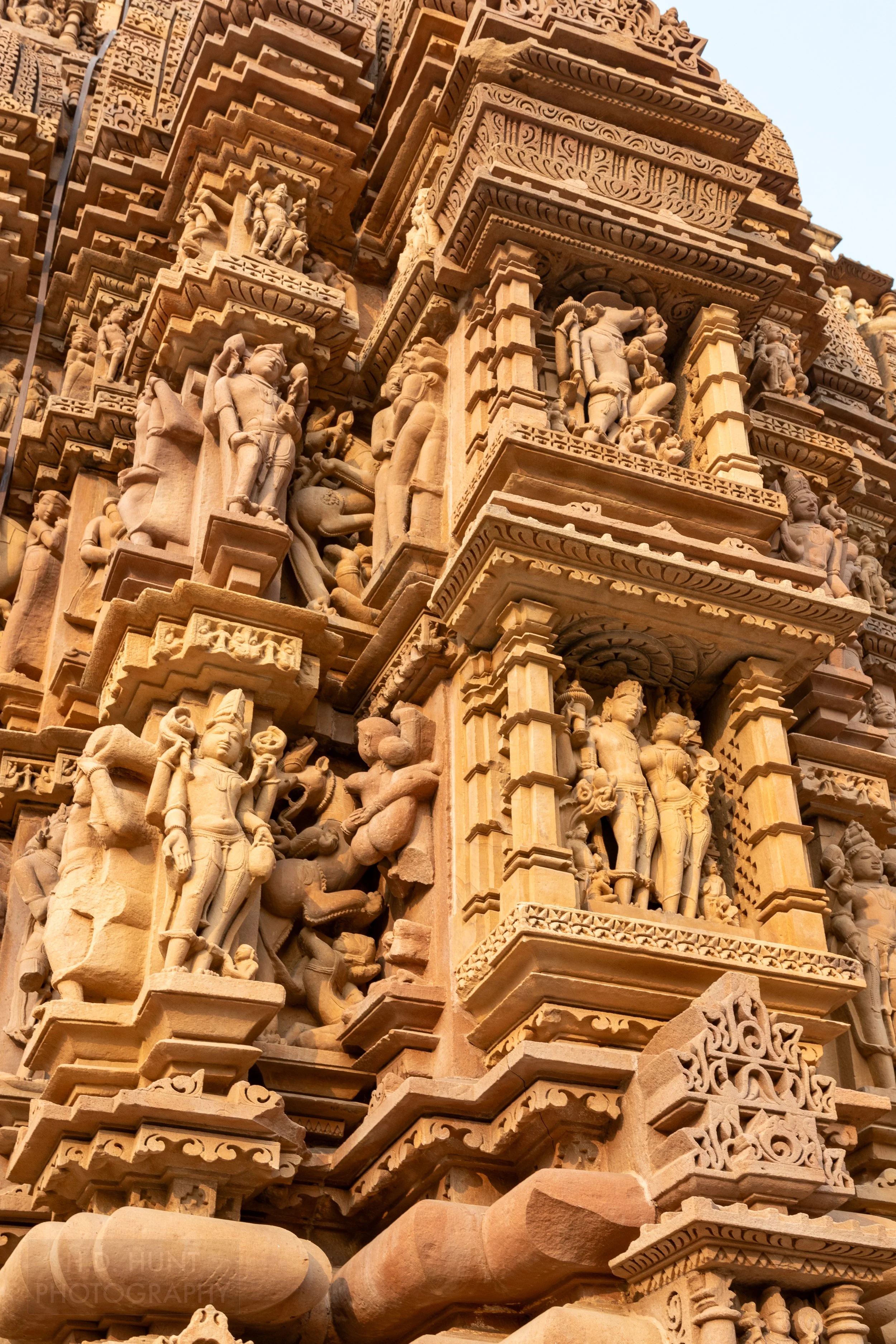 Close-up of the stone carvings adoring Kandariya Mahadeva, Khajuraho Group of Monuments, India.