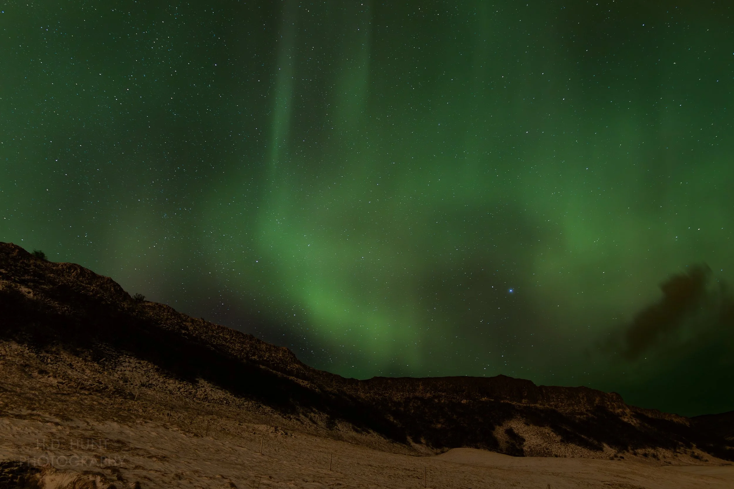 The green light of Aurora Borealis - the Northern Lights - is seen north of Reykholt í Biskupstungum, Iceland.
