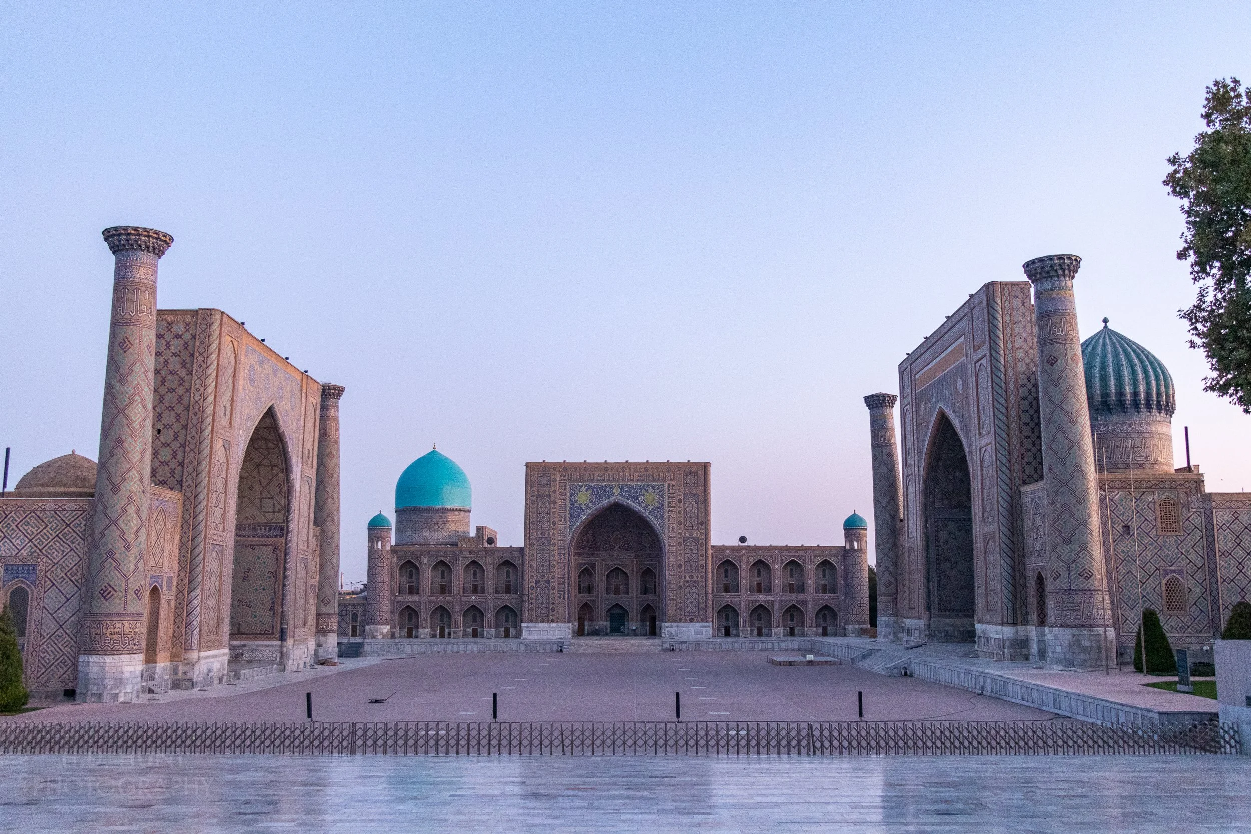 Registan illuminated at sunrise, Samarkand, Uzbekistan.