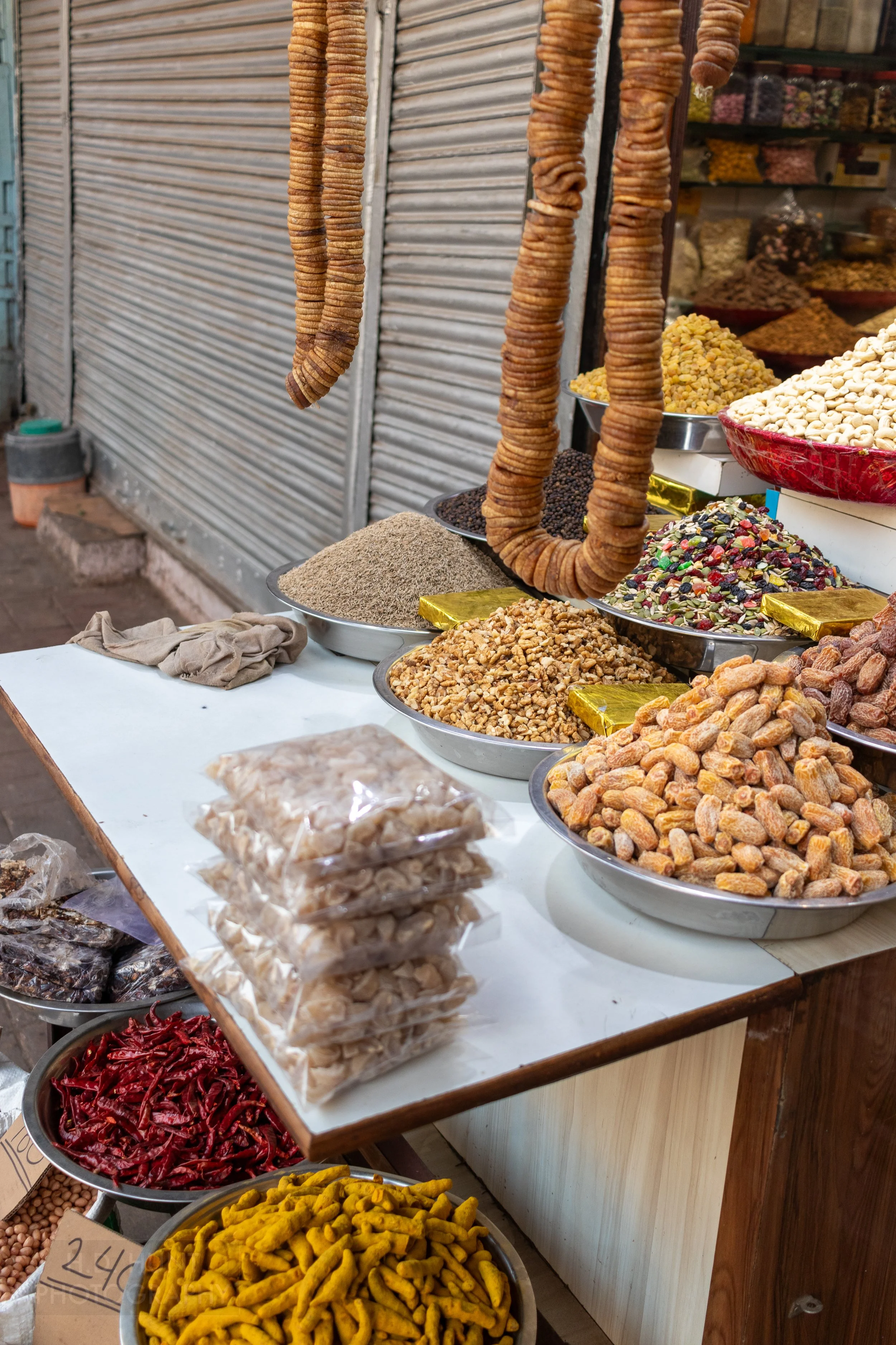 Nuts, fruits, and spices for sale at a market stall, Chandni Chowk, Delhi, India.