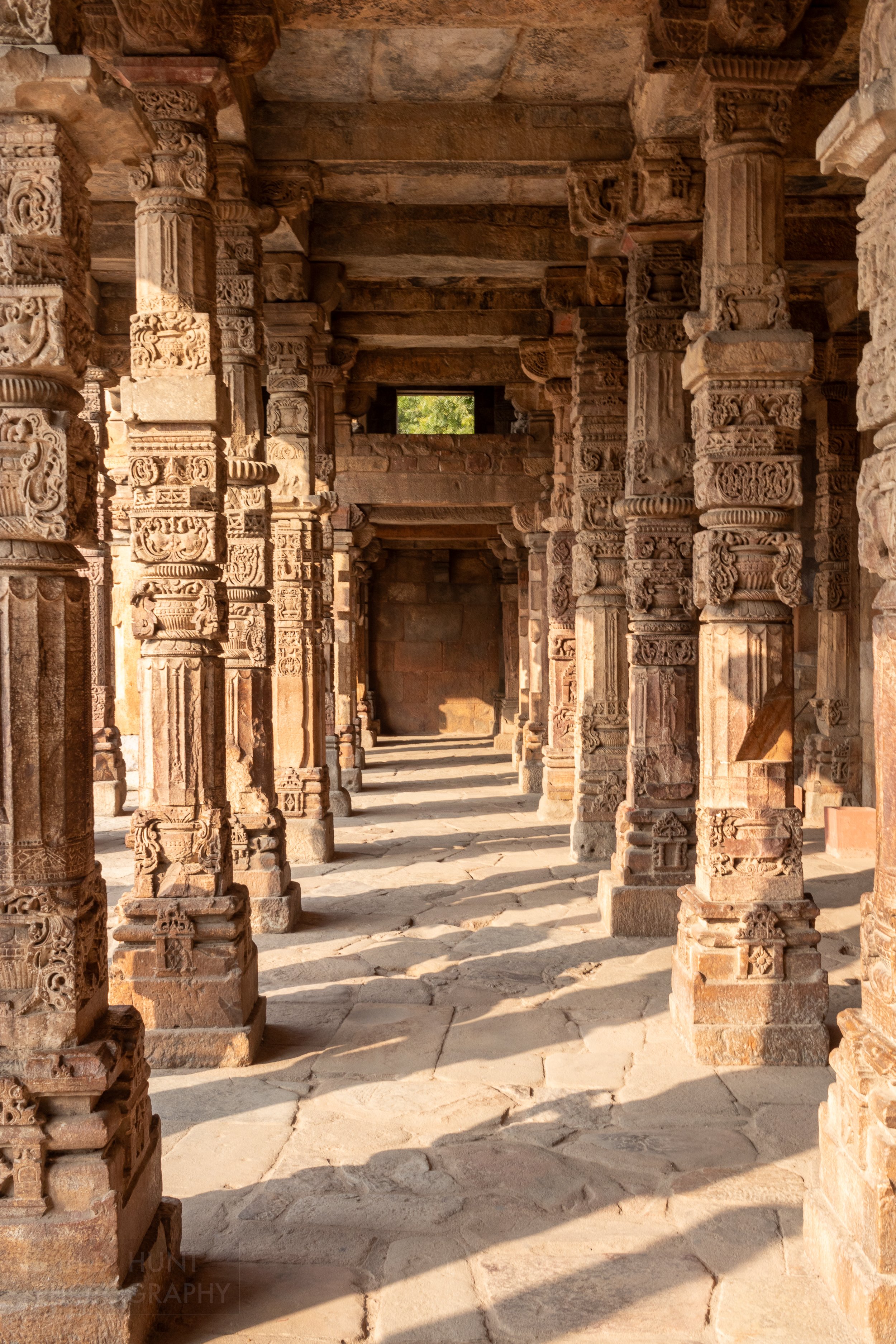 Carved stone columns within the Qutub Minar complex, Delhi, India.