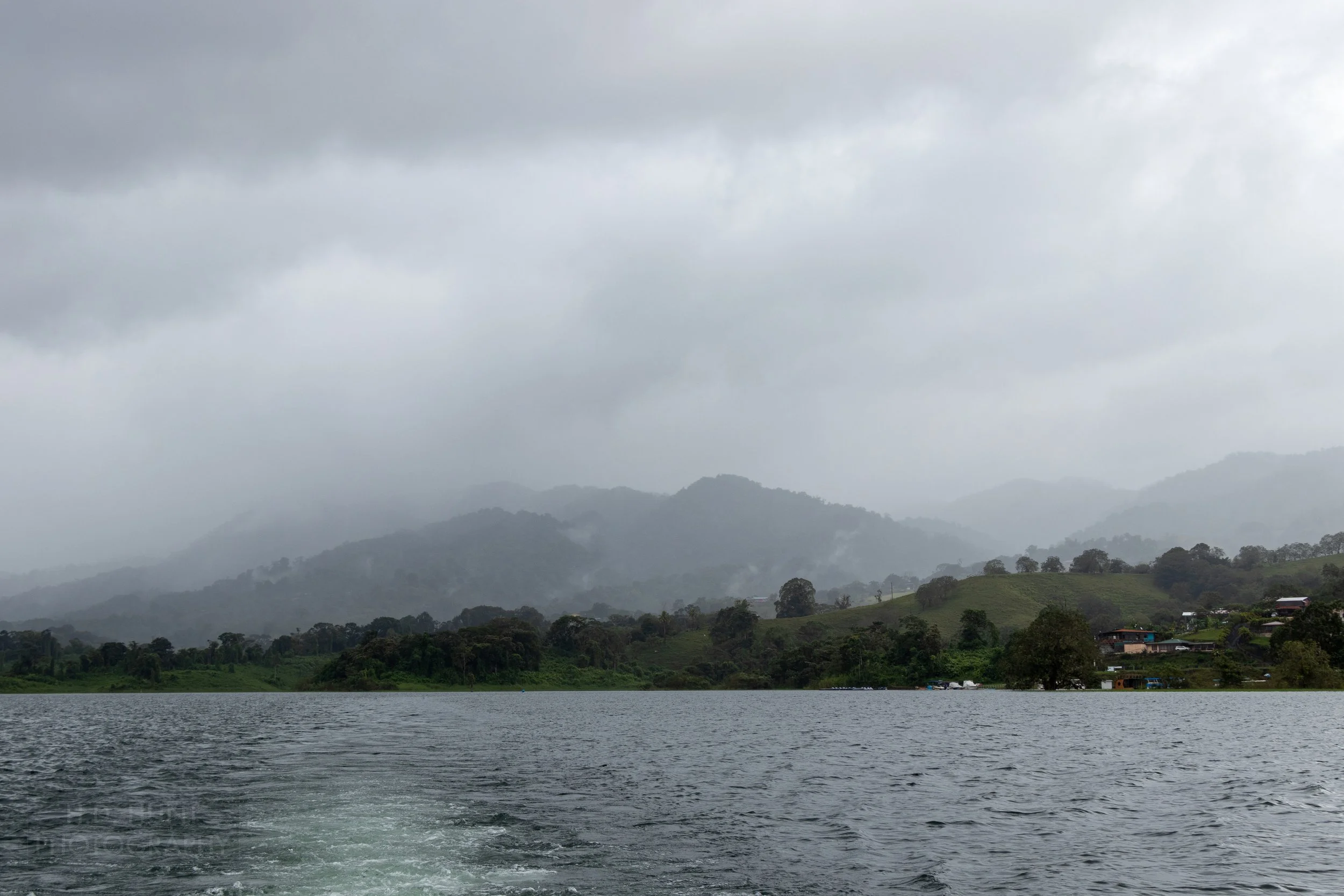 The mountains surrounding Lake Arenal are obscured by clouds, Costa Rica.