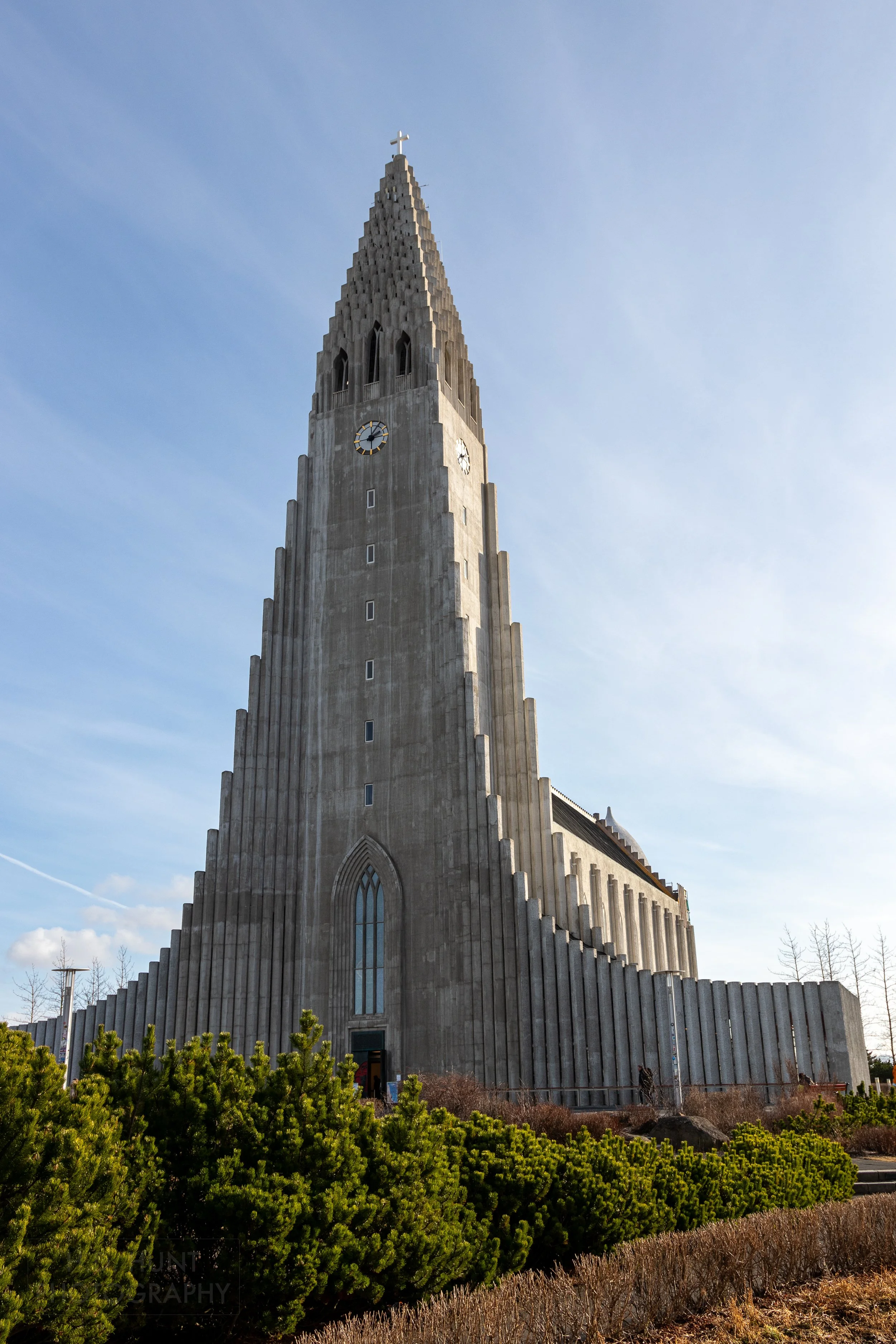 The grey, slender exterior tower of Hallgrímskirkja, Reykjavík, Iceland.