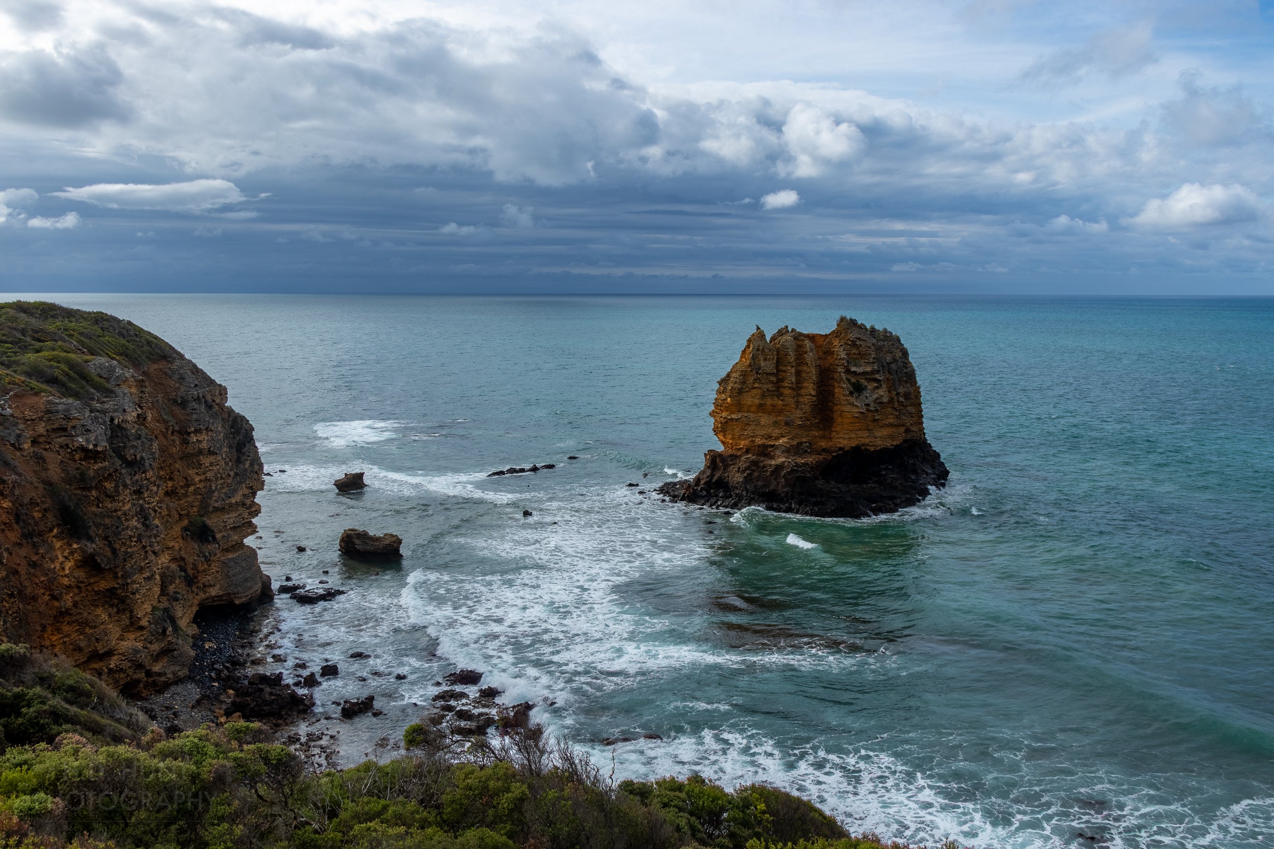 Eagle Rock rises above the Bass Strait at Spit Point, Aireys Inlet, Victoria, Australia.