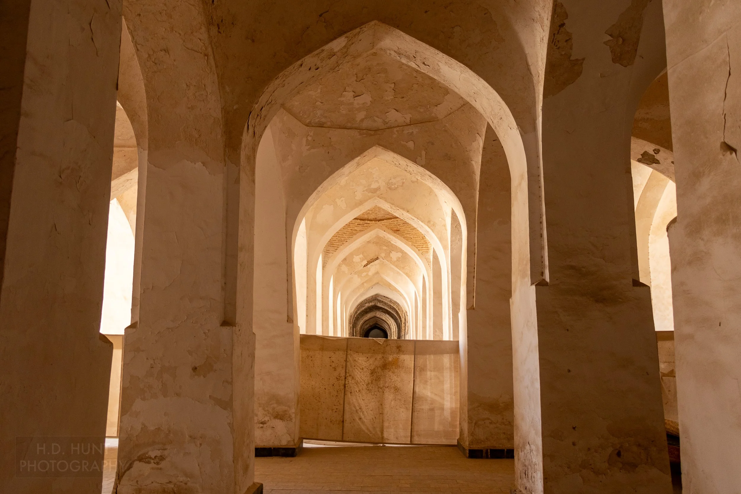 Large archways under restoration within Kalan Mosque, Bukhara, Uzbekistan.