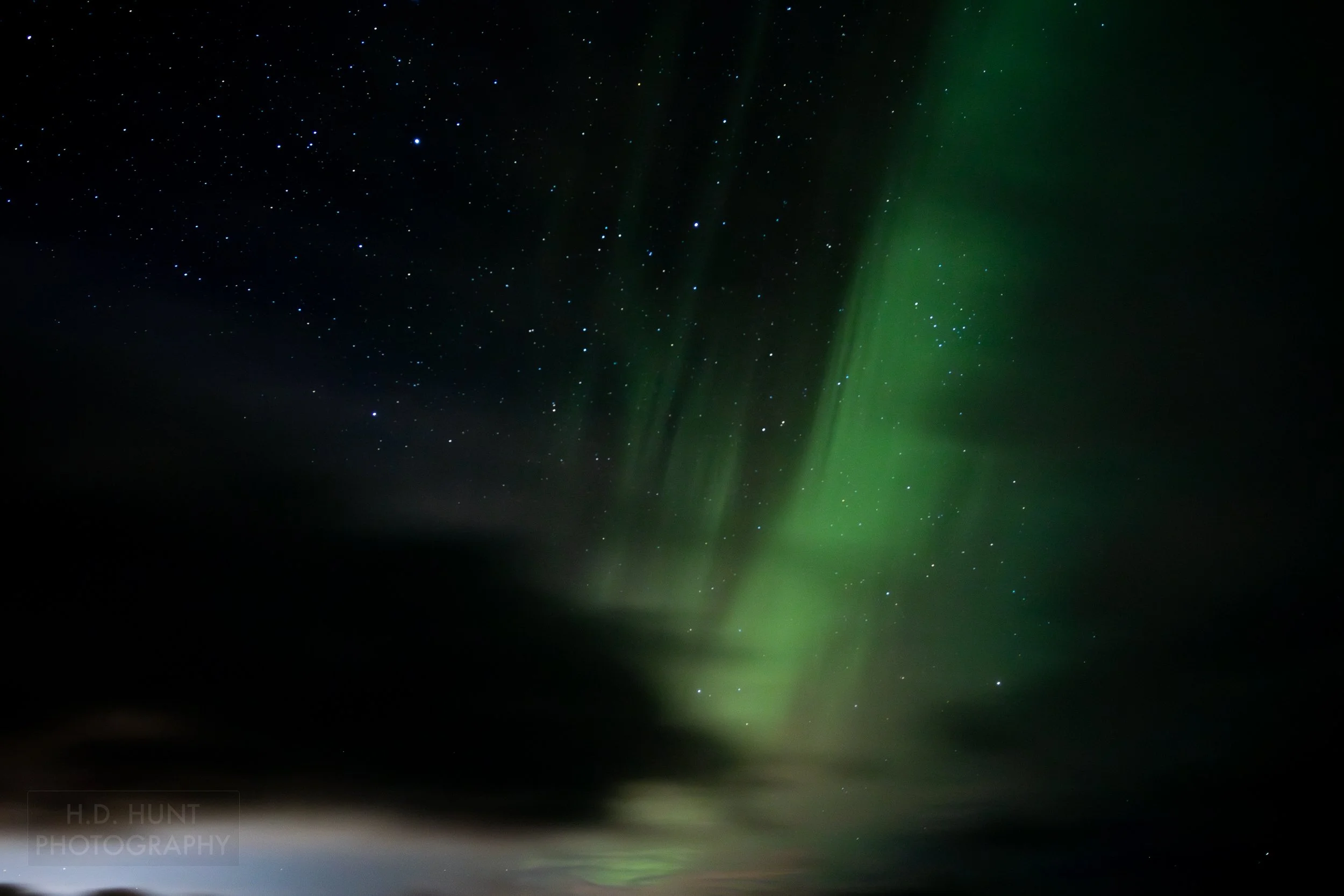 The green light of Aurora Borealis - the Northern Lights - is seen north of Grindavik on the Reykjanes Peninsula, Iceland.