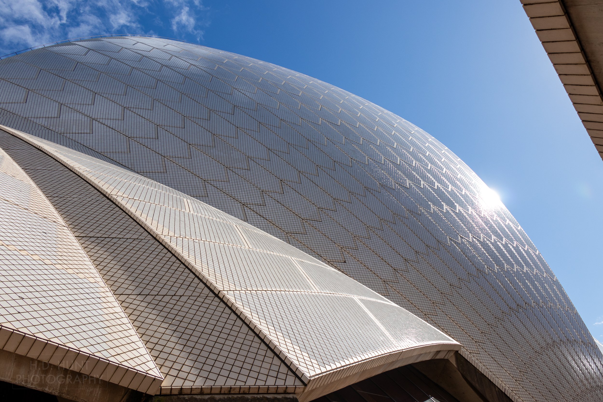 The sun reflects of the Sydney Opera House roof, Sydney, New South Wales, Australia.