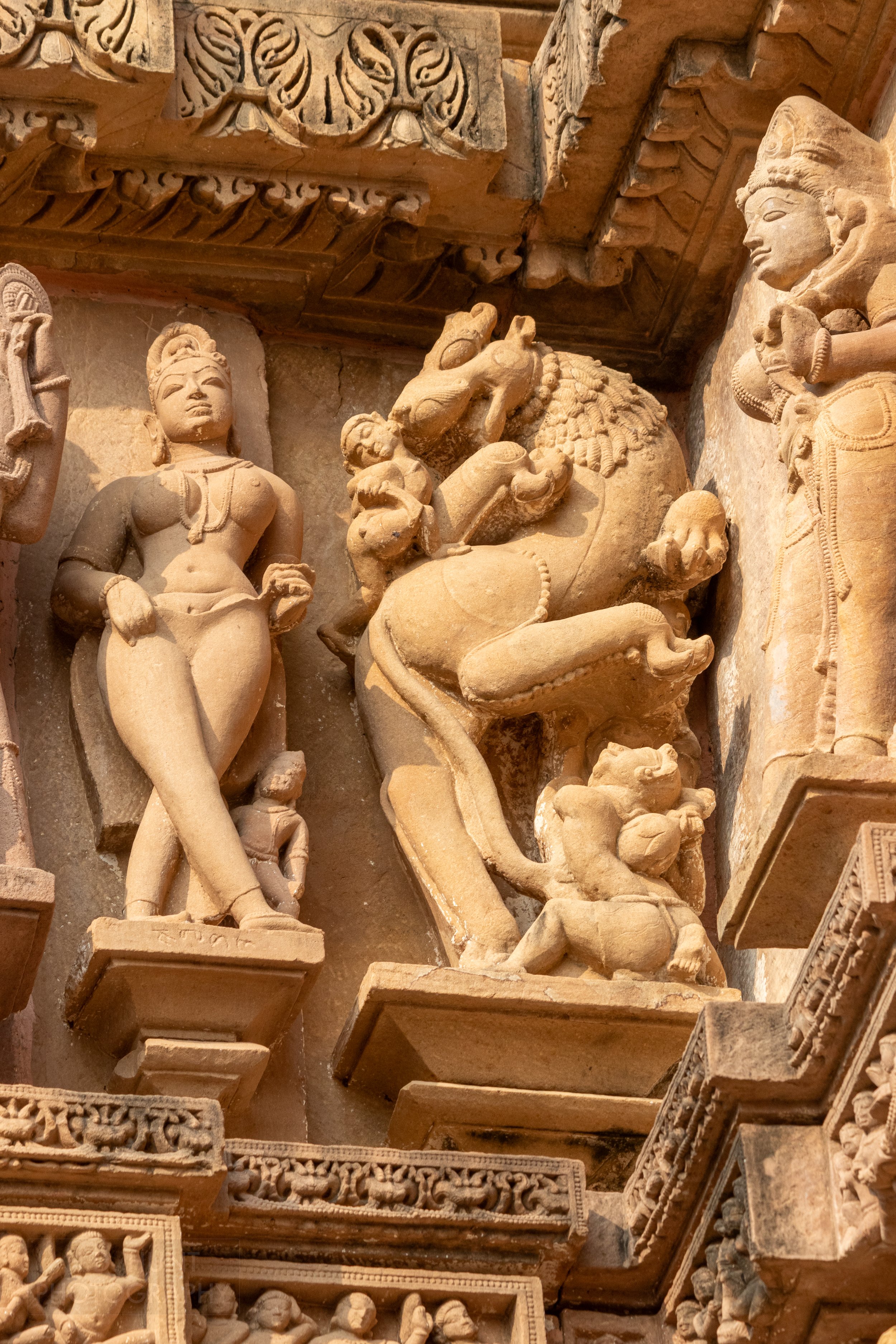 Close-up of the stone carvings adoring the Lakshmana Temple, Khajuraho Group of Monuments, India.