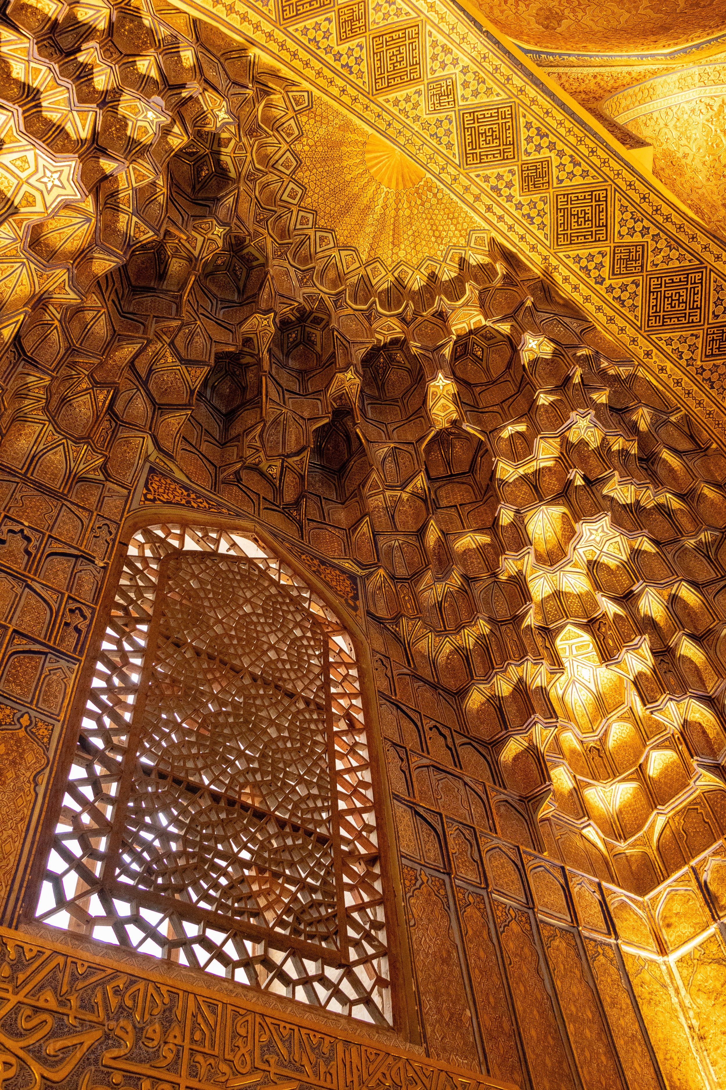 Close-up of the golden ceiling inside Guri Amir mausoleum in Samarkand, Uzbekistan.