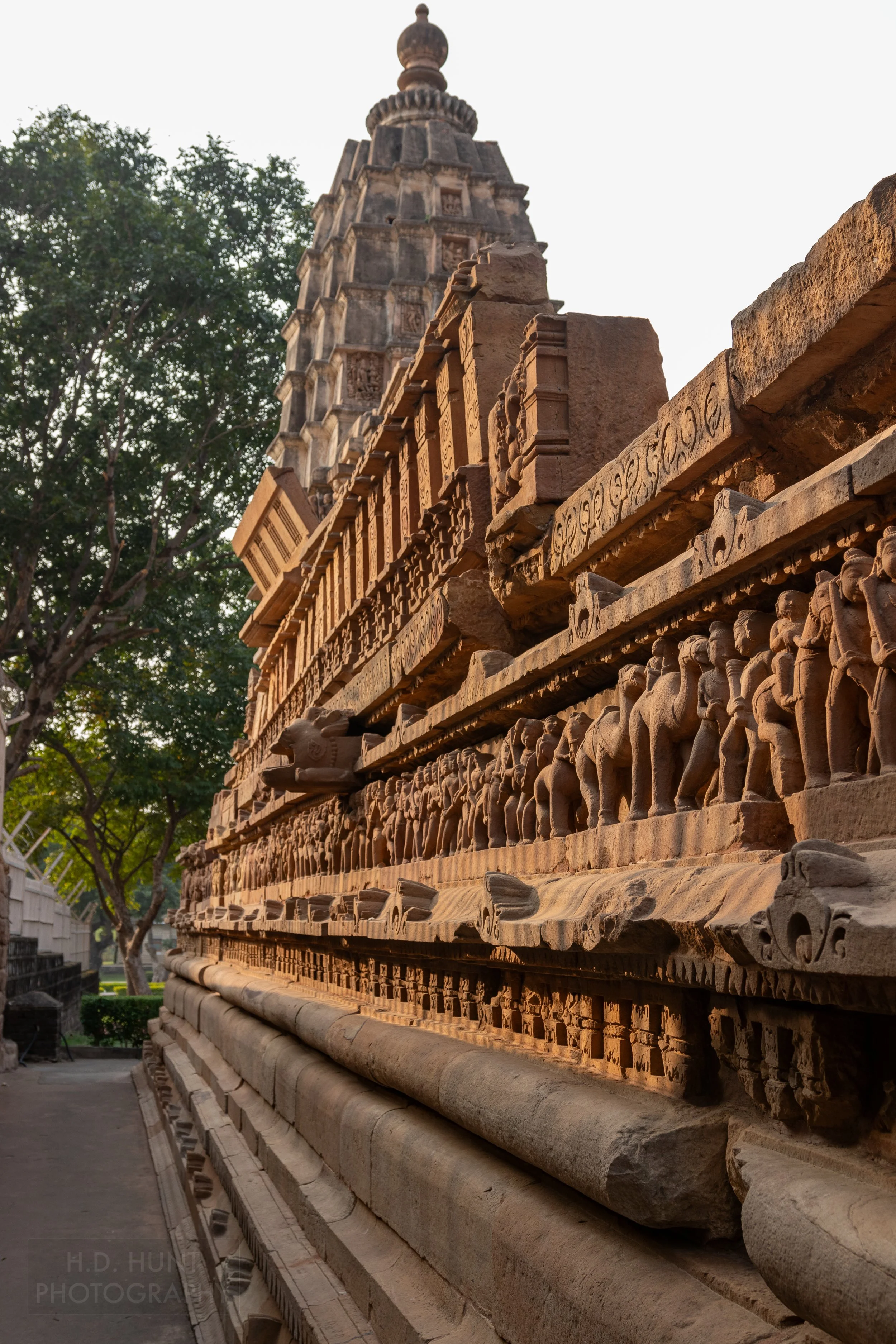 Close-up of the stone carvings adoring the Lakshmana Temple, Khajuraho Group of Monuments, India.