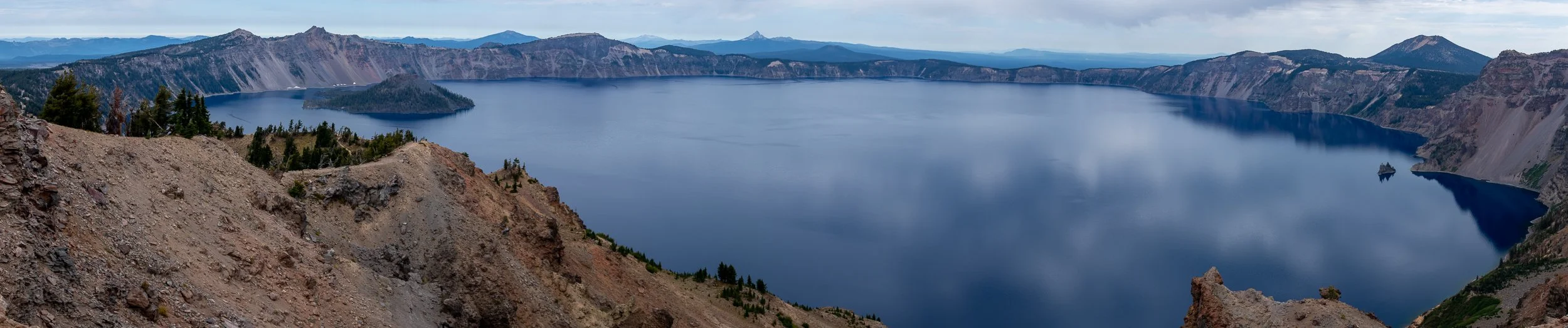 A panorama of the blue waters of Crater Lake taken from Garfield Peak, Oregon, United States.