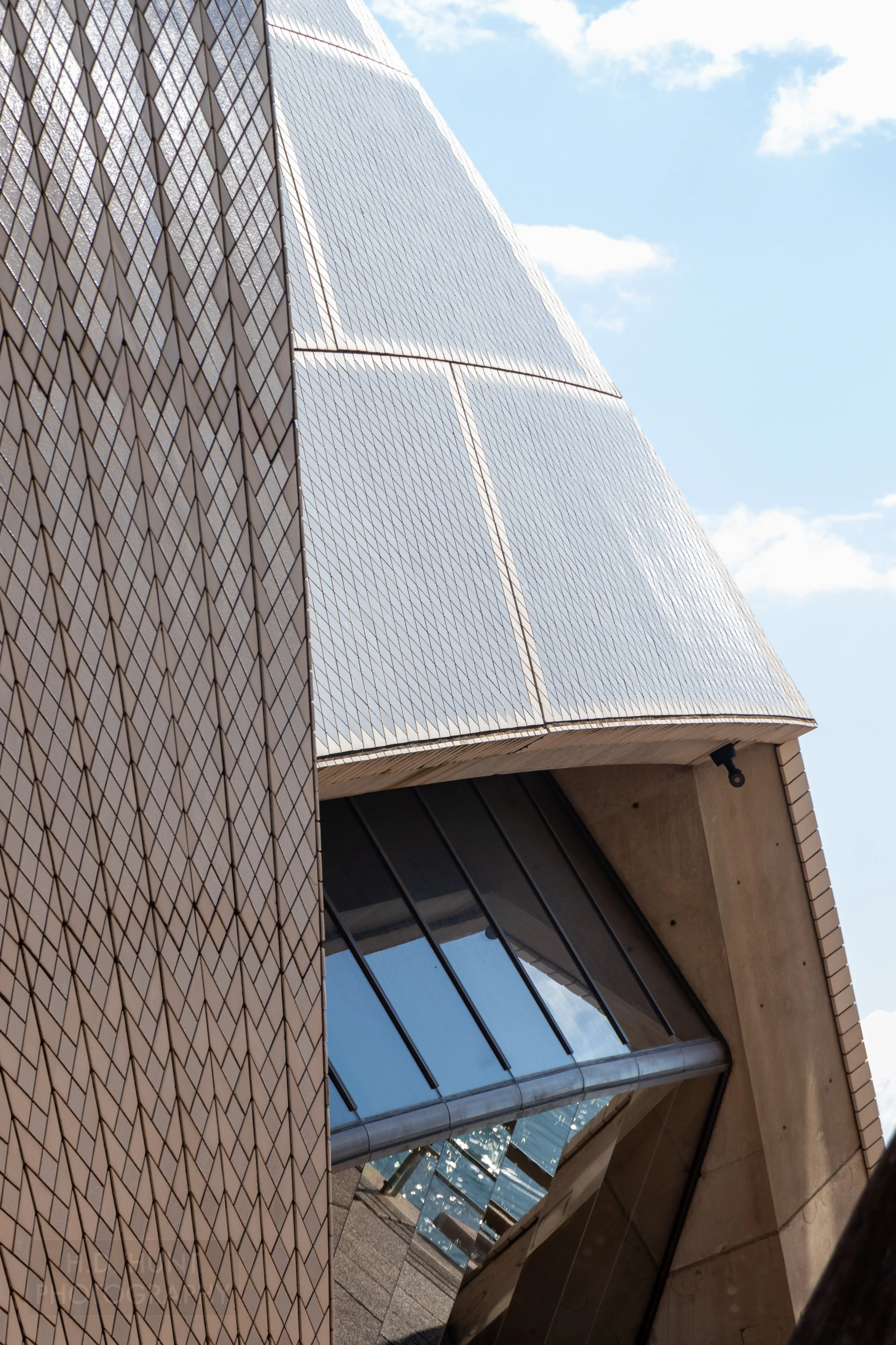 The roof and exterior windows of the Sydney Opera House is seen, including details of the roof's tiles, Sydney, New South Wales, Australia.