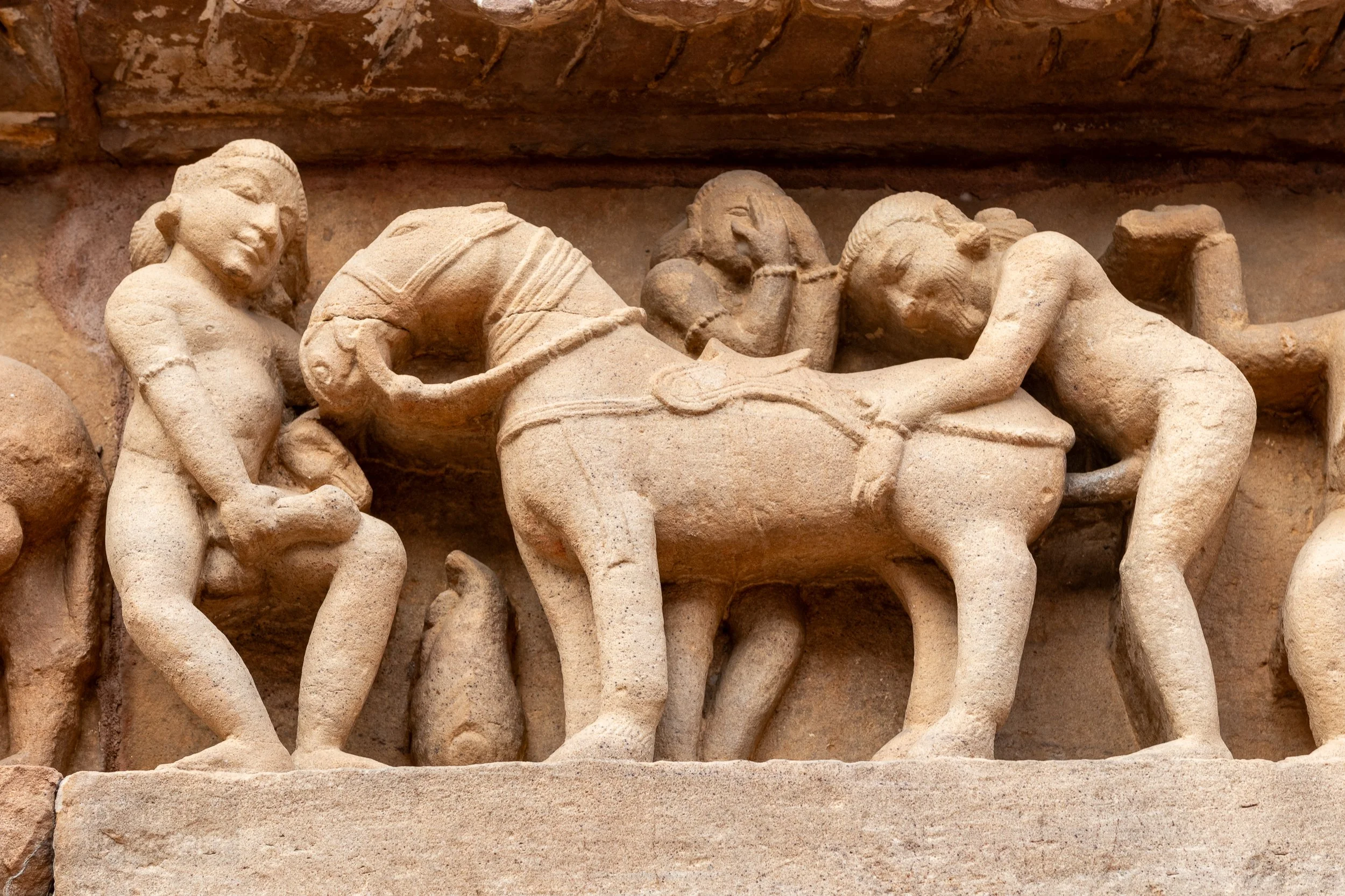 Close-up of the stone carvings adoring the Lakshmana Temple, Khajuraho Group of Monuments, India.