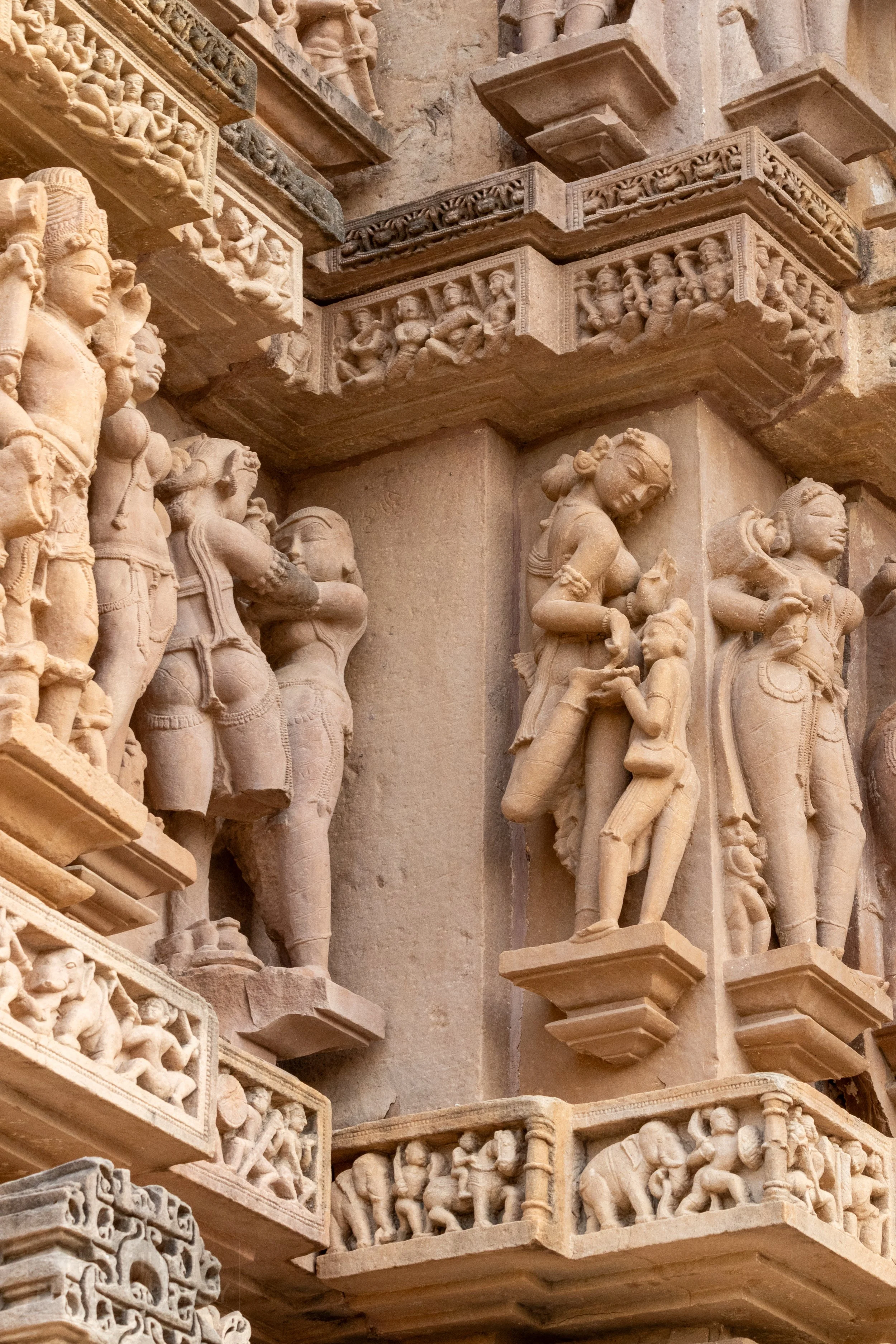 Close-up of the stone carvings adoring the Lakshmana Temple, Khajuraho Group of Monuments, India.