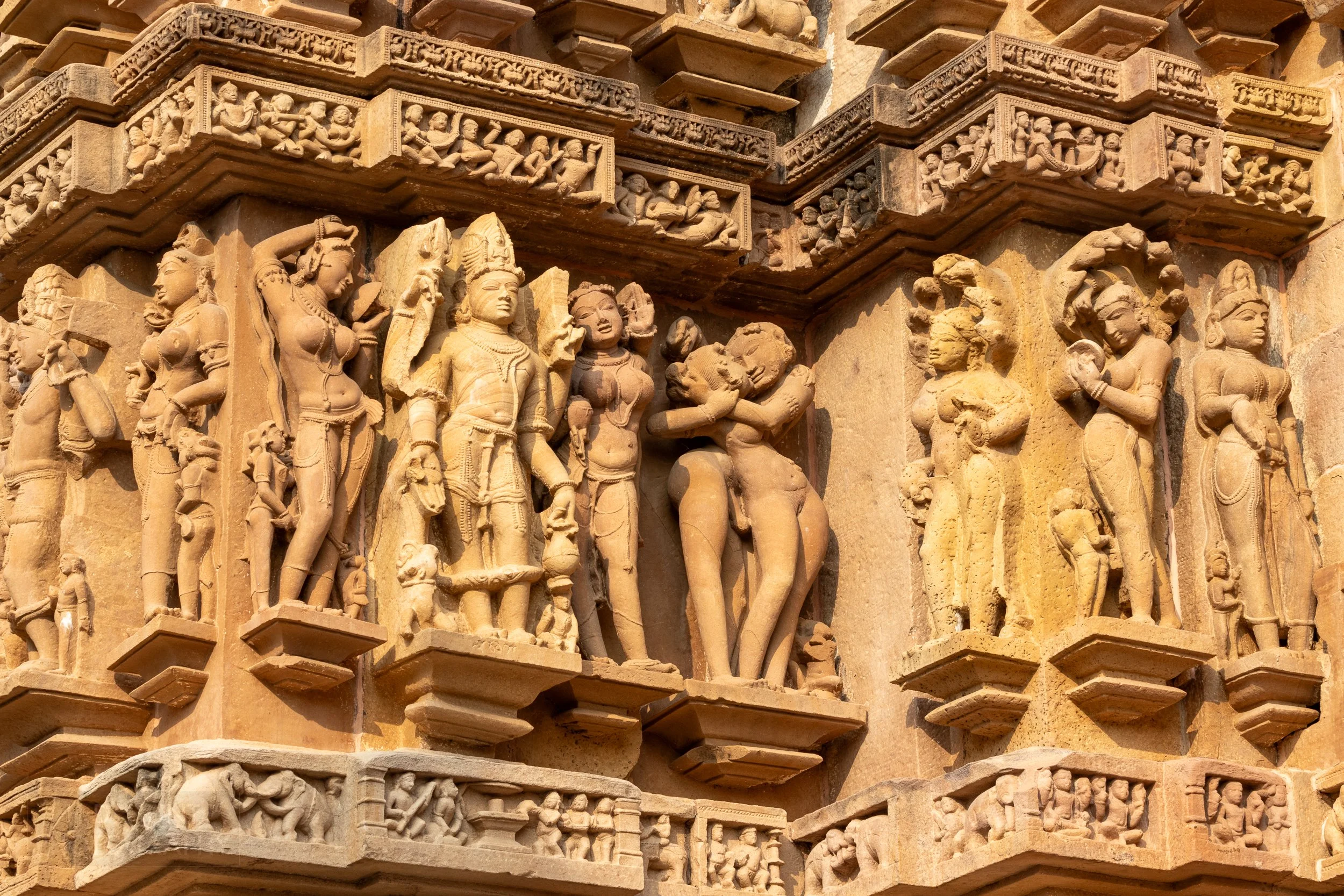 Close-up of the stone carvings adoring the Lakshmana Temple, Khajuraho Group of Monuments, India.