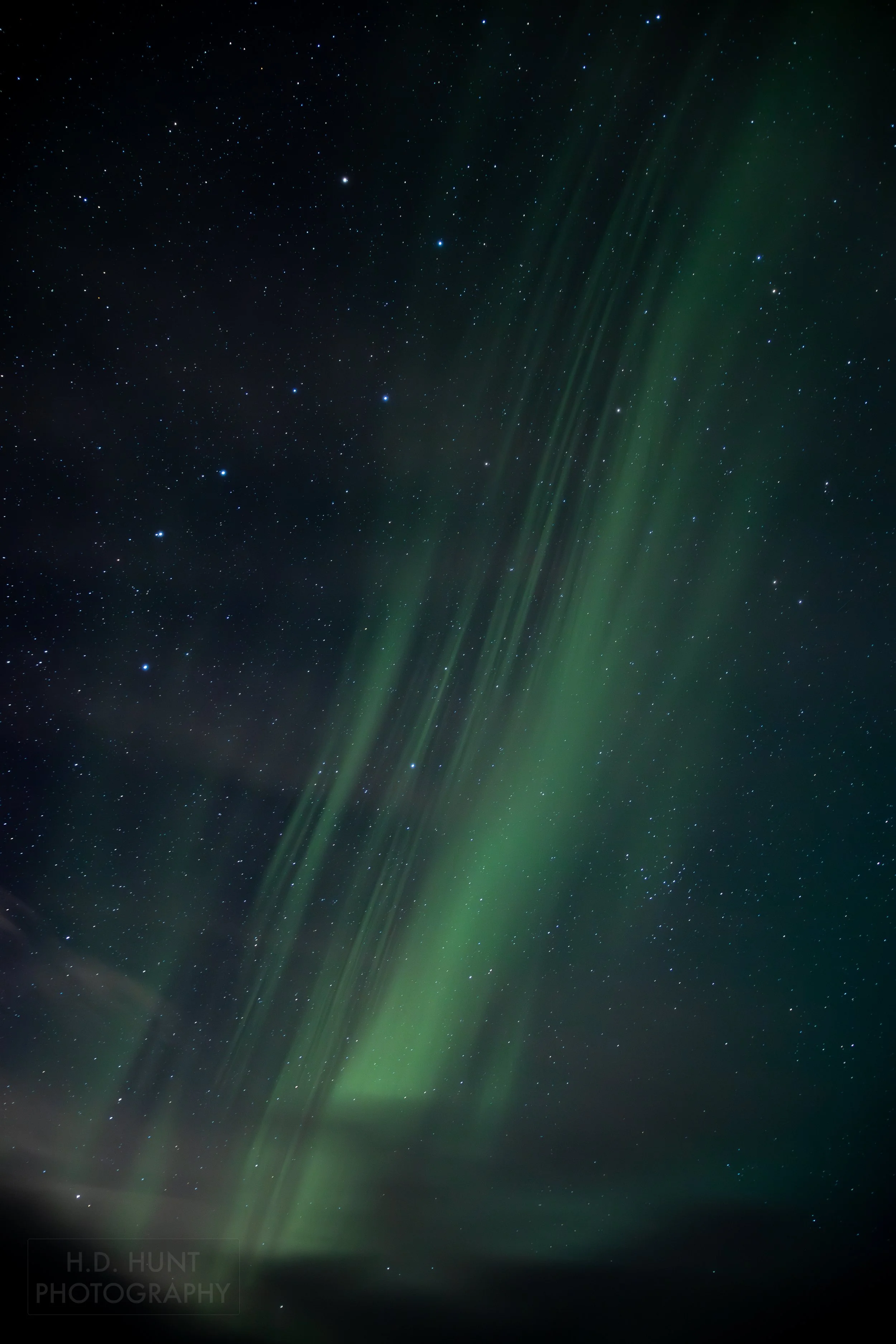 The green light of Aurora Borealis - the Northern Lights - is seen north of Grindavik on the Reykjanes Peninsula, Iceland.