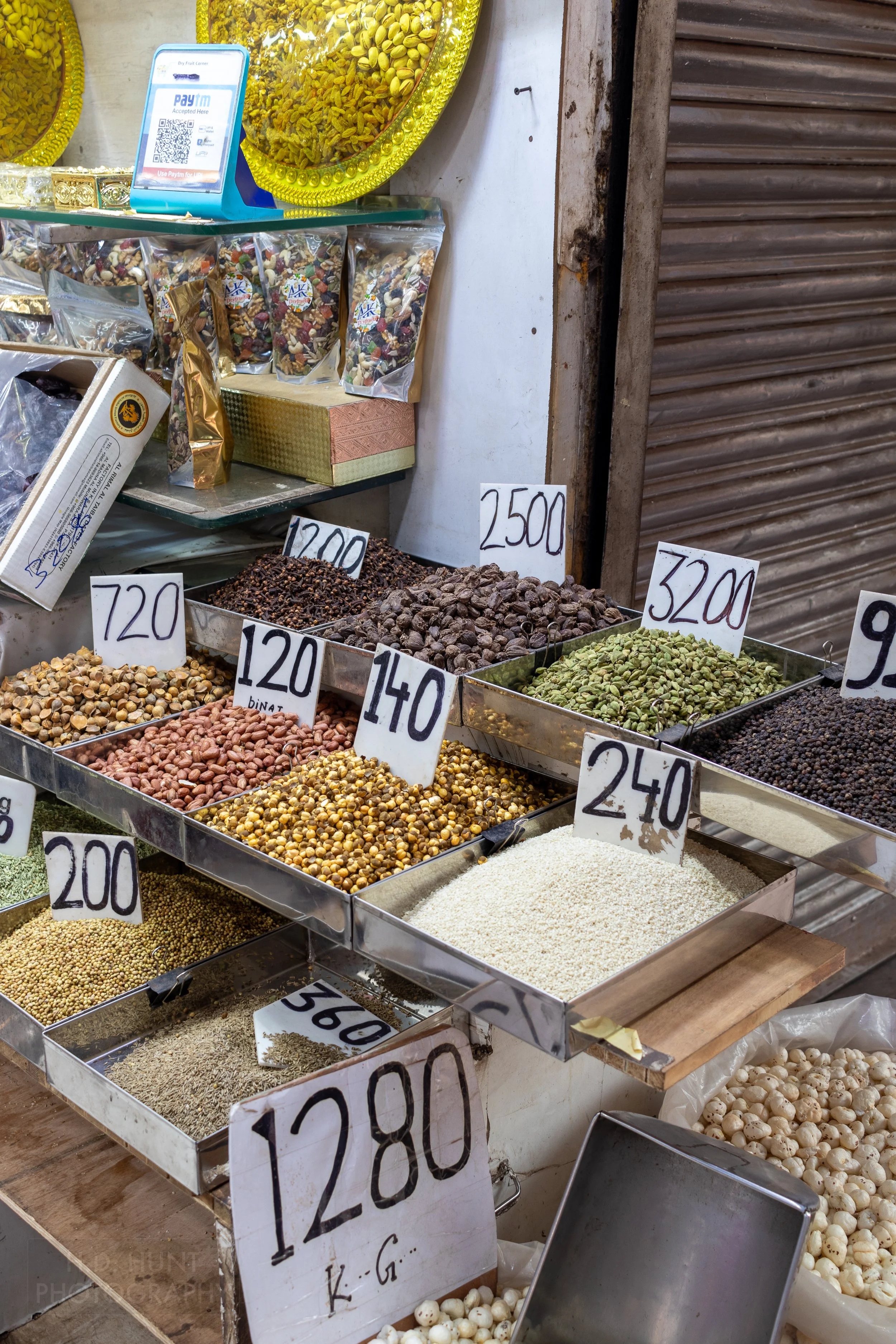 Dried nuts and spices for sale at a market stall, Chandni Chowk, Delhi, India.