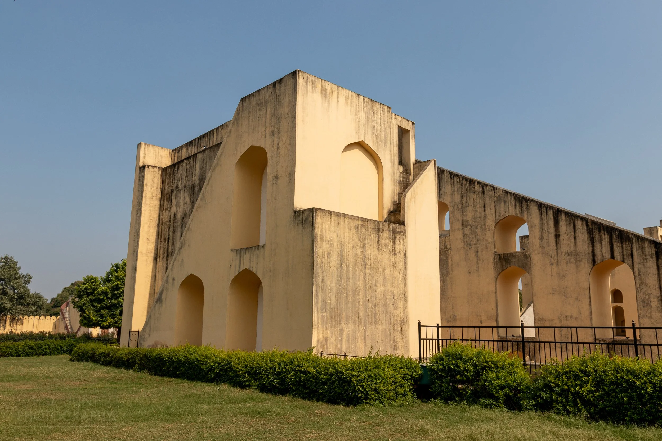 A large yellow structure made of stone, Jantar Mantar, Jaipur, India.