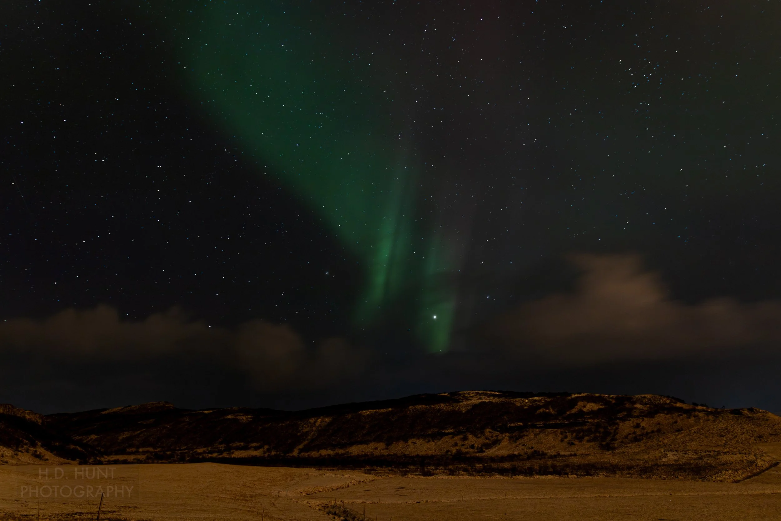 The green light of Aurora Borealis - the Northern Lights - is seen north of Reykholt í Biskupstungum, Iceland.