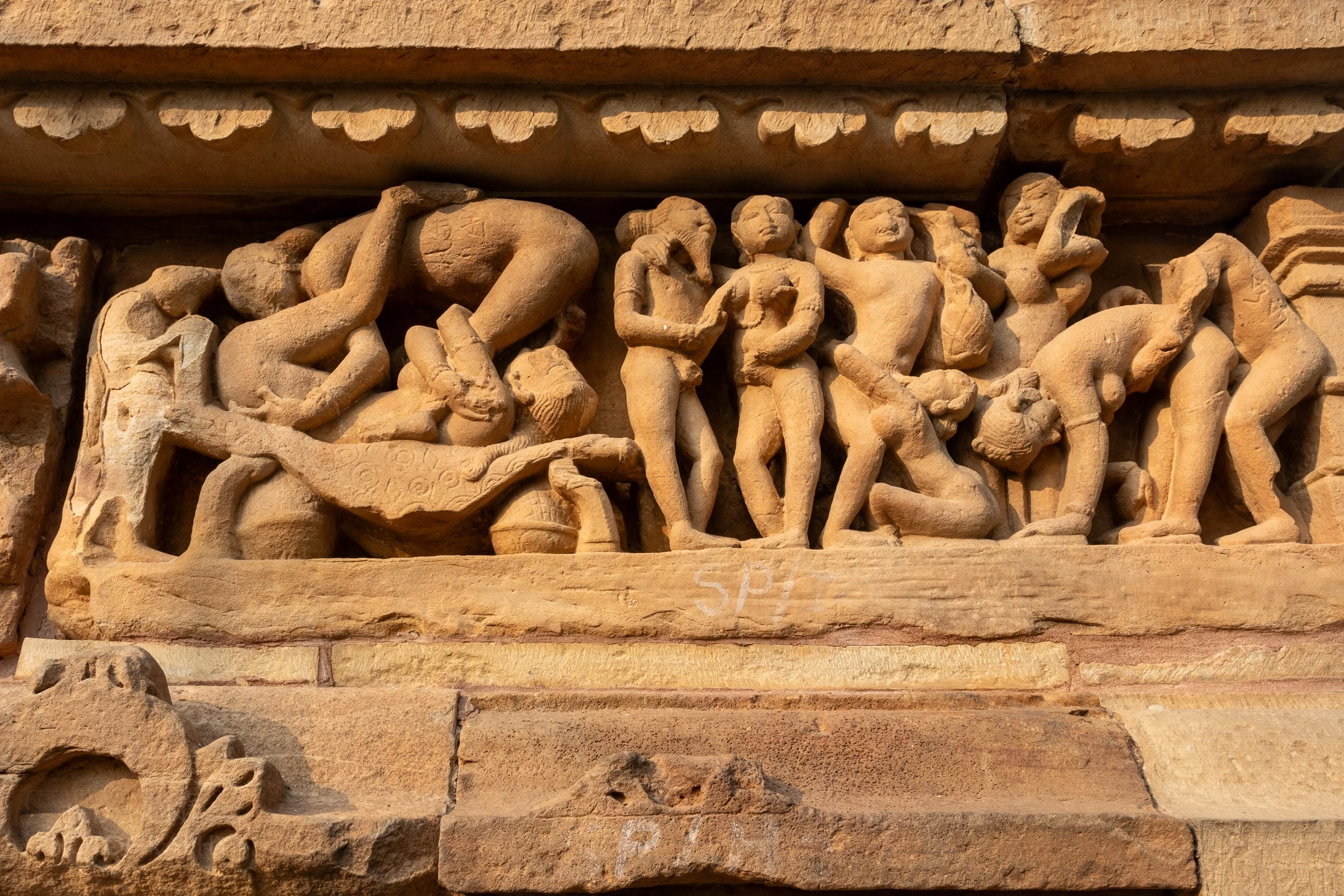 Close-up of the stone carvings adoring the Lakshmana Temple, Khajuraho Group of Monuments, India.