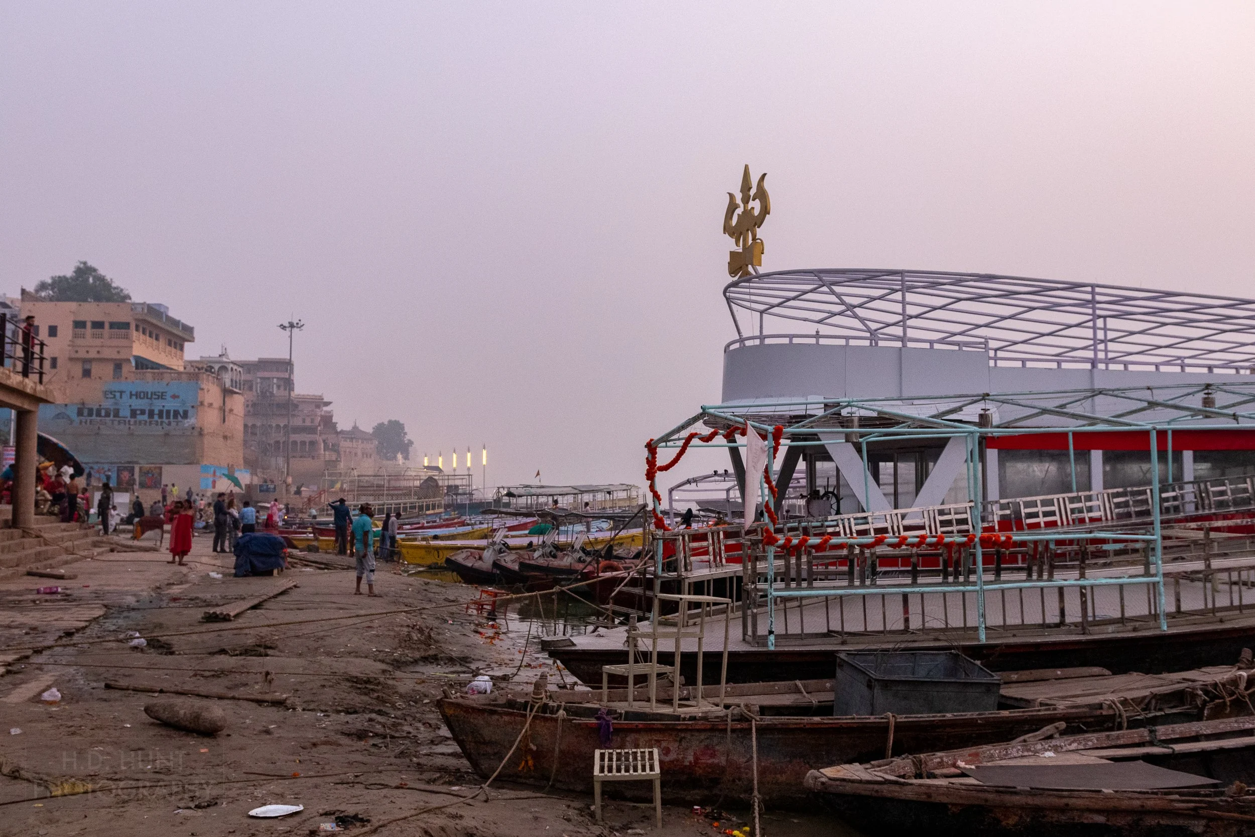 Several boats moored along the Ganges River, Varanasi, India.