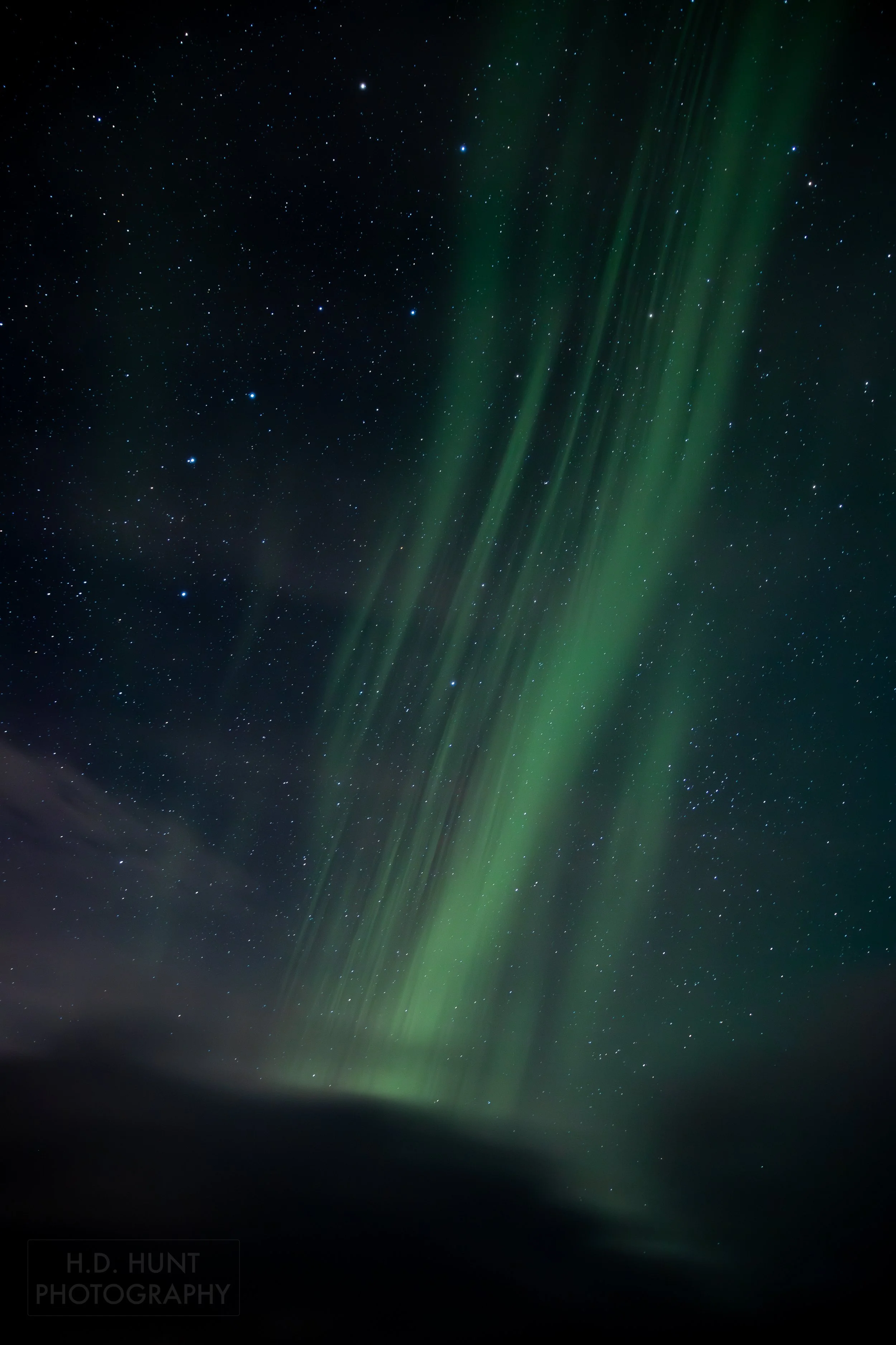 The green light of Aurora Borealis - the Northern Lights - is seen north of Grindavik on the Reykjanes Peninsula, Iceland.