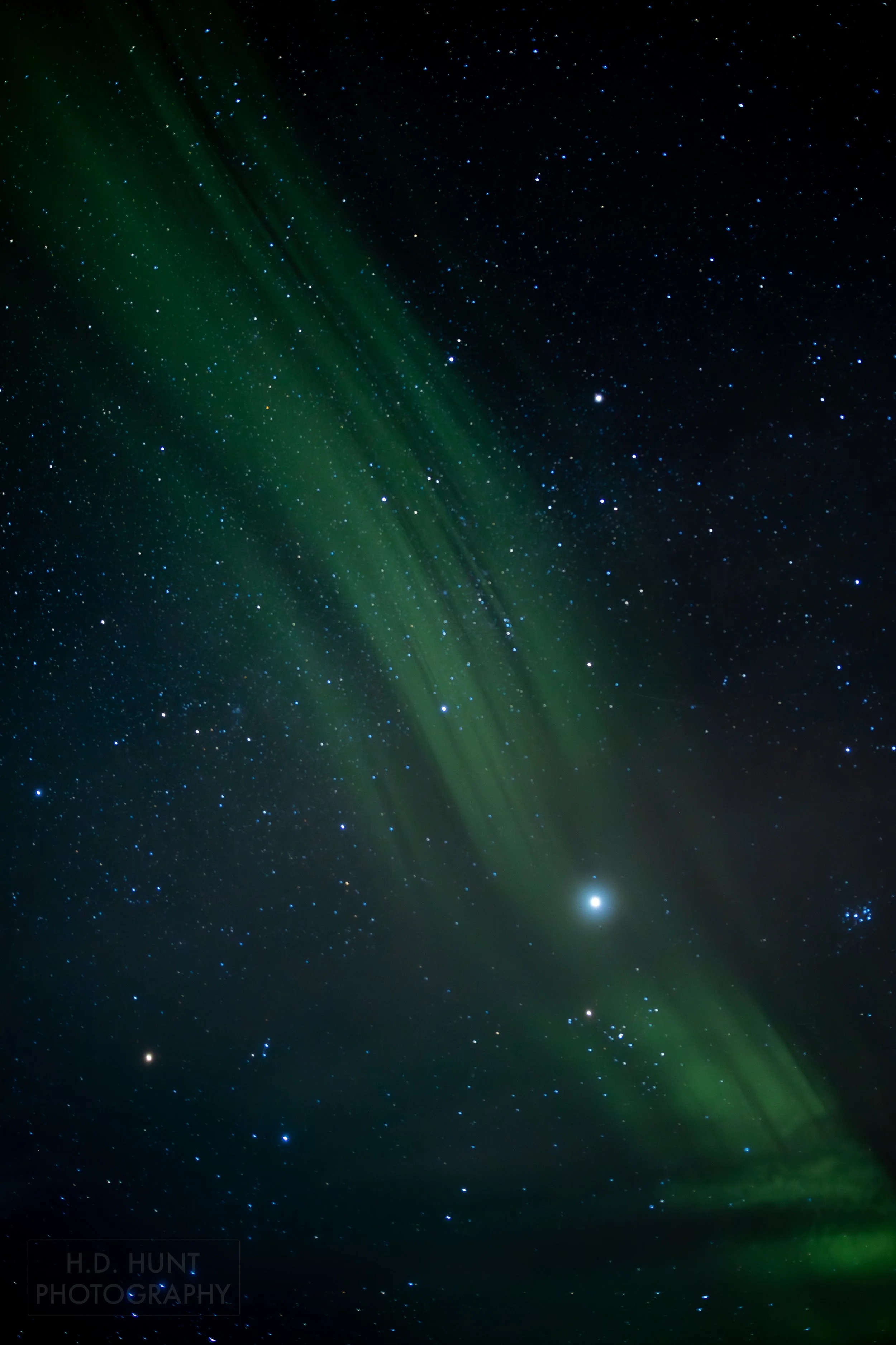 The green light of Aurora Borealis - the Northern Lights - is seen north of Grindavik on the Reykjanes Peninsula, Iceland.