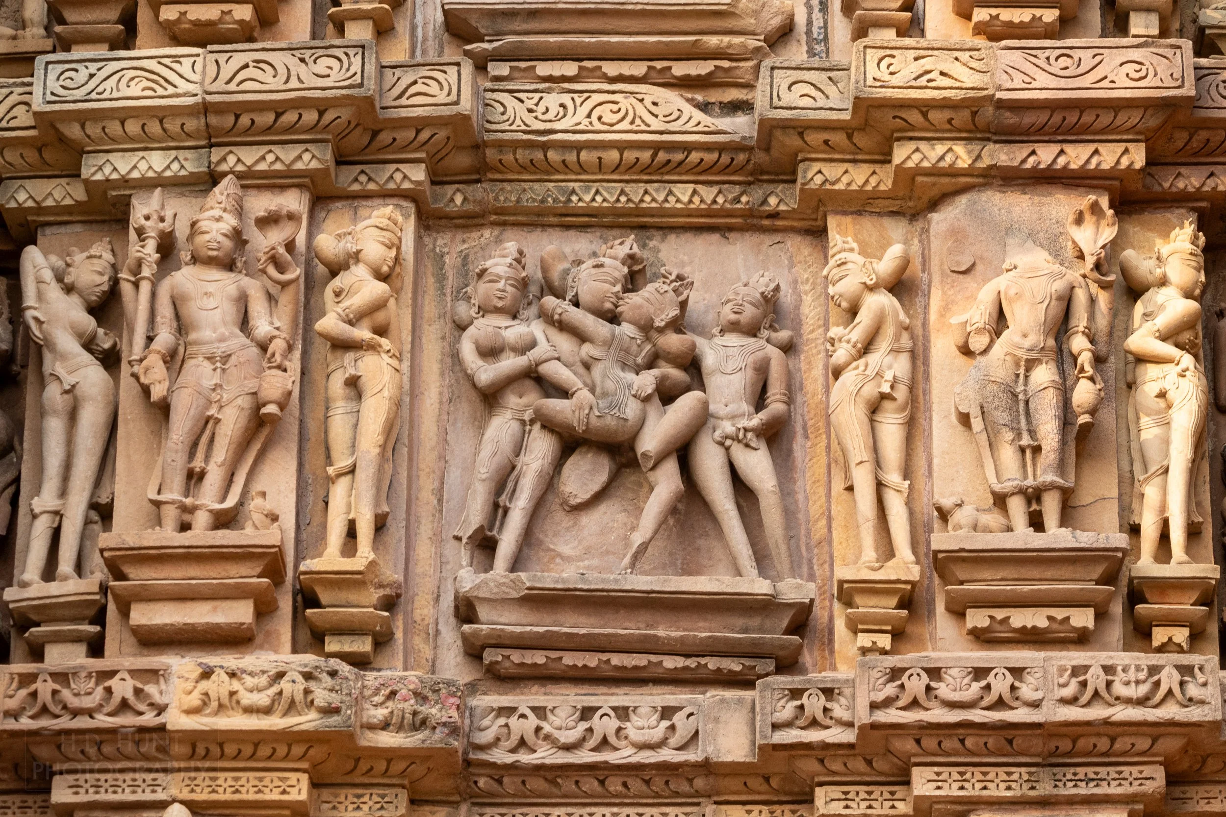 Close-up of the stone carvings adoring Kandariya Mahadeva, Khajuraho Group of Monuments, India.