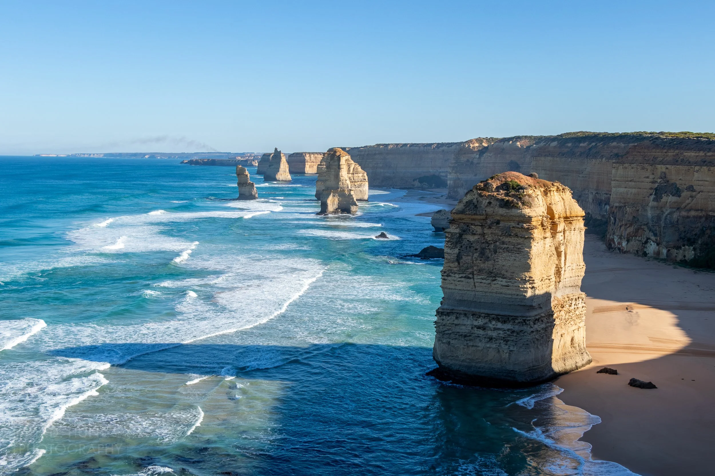 Several of The Twelve Apostles limestone stacks are seen from the Saddle Viewpoint, Victoria, Australia.