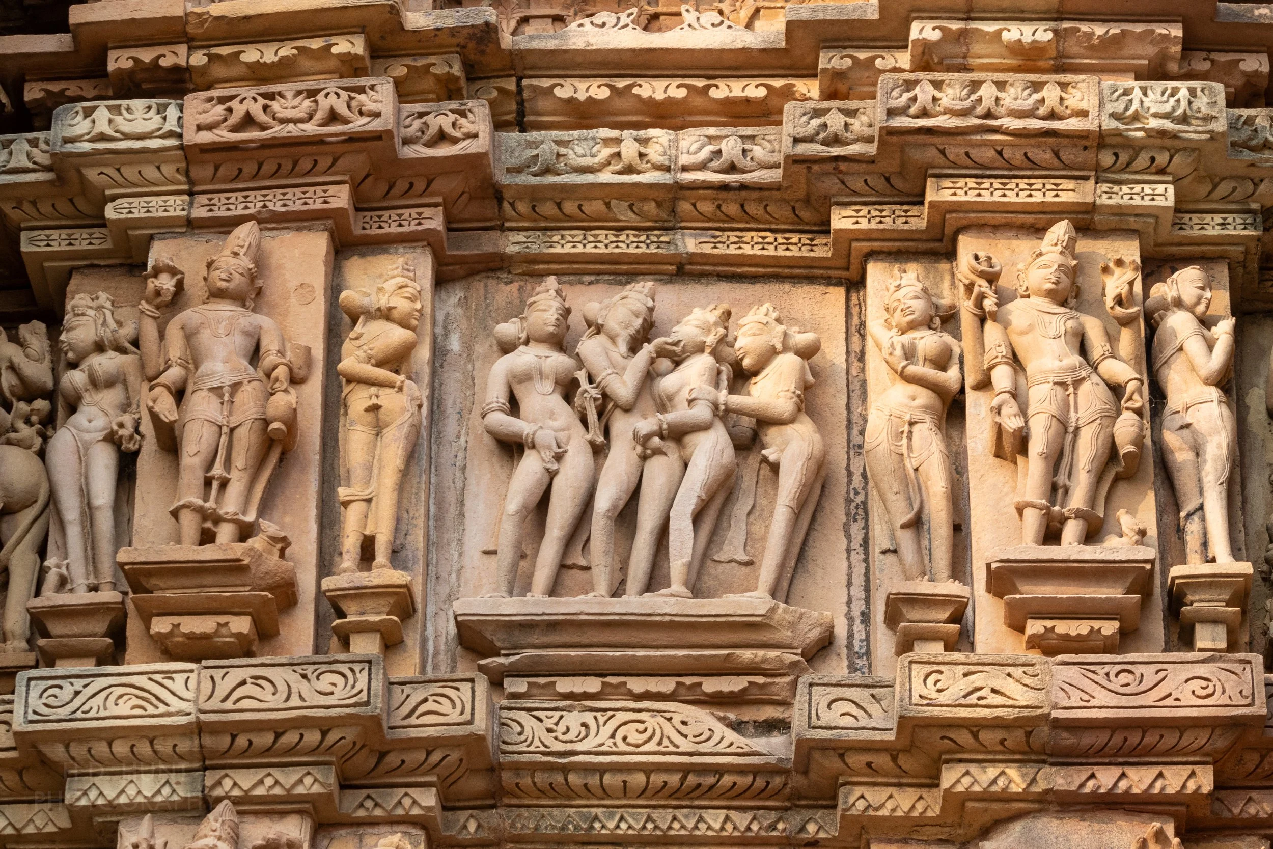 Close-up of the stone carvings adoring Kandariya Mahadeva, Khajuraho Group of Monuments, India.