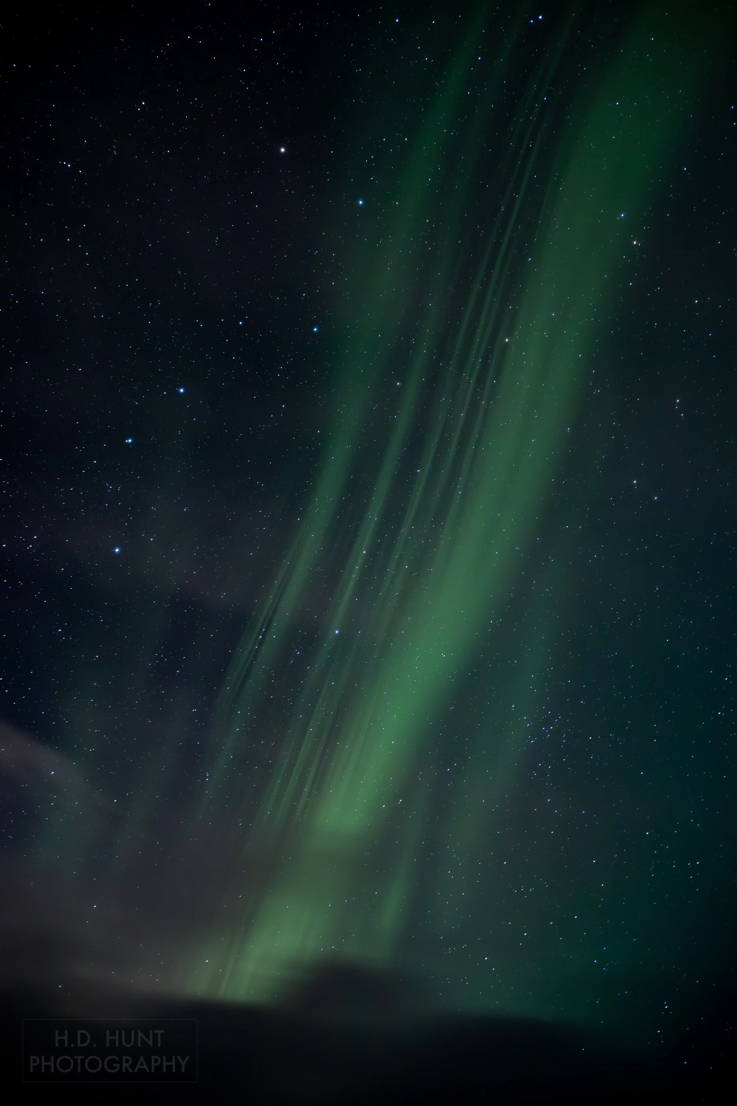 The green light of Aurora Borealis - the Northern Lights - is seen north of Grindavik on the Reykjanes Peninsula, Iceland.