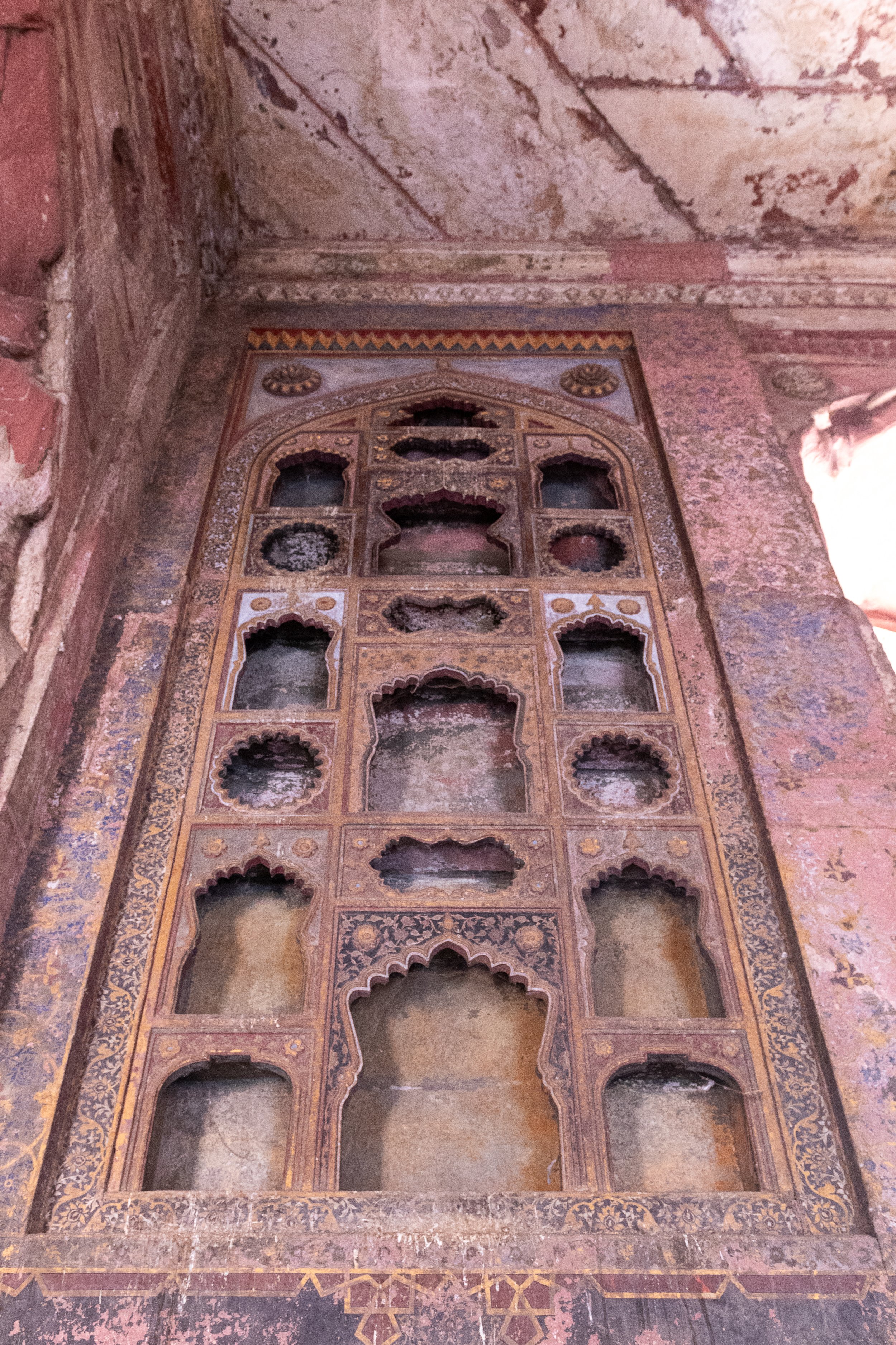 Ornamental shapes are carved into a wall inside Agra Fort, Agra, India.