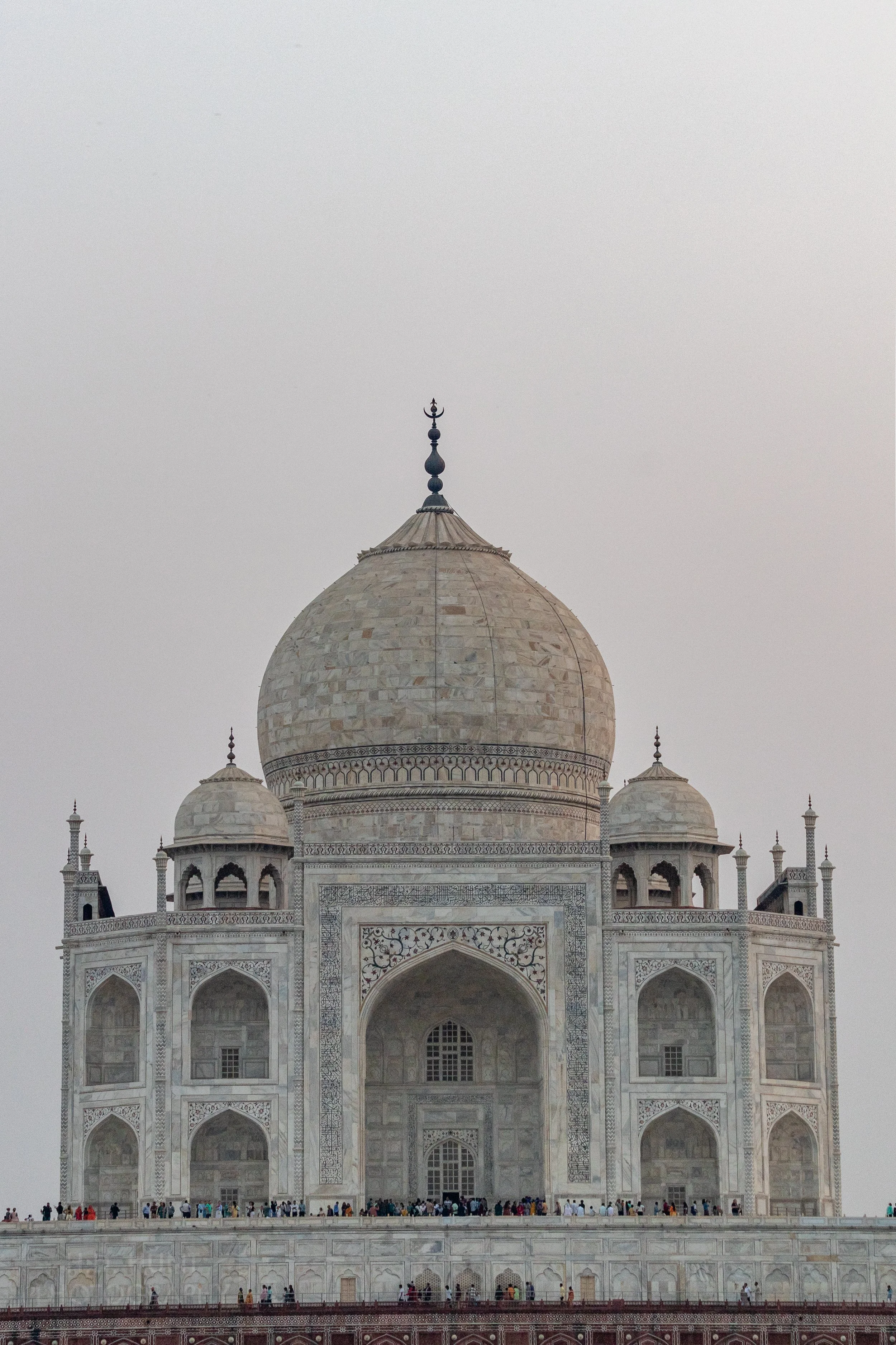 The main buildings of the Taj Mahal are seen from across the Yamuna River, Agra, India.