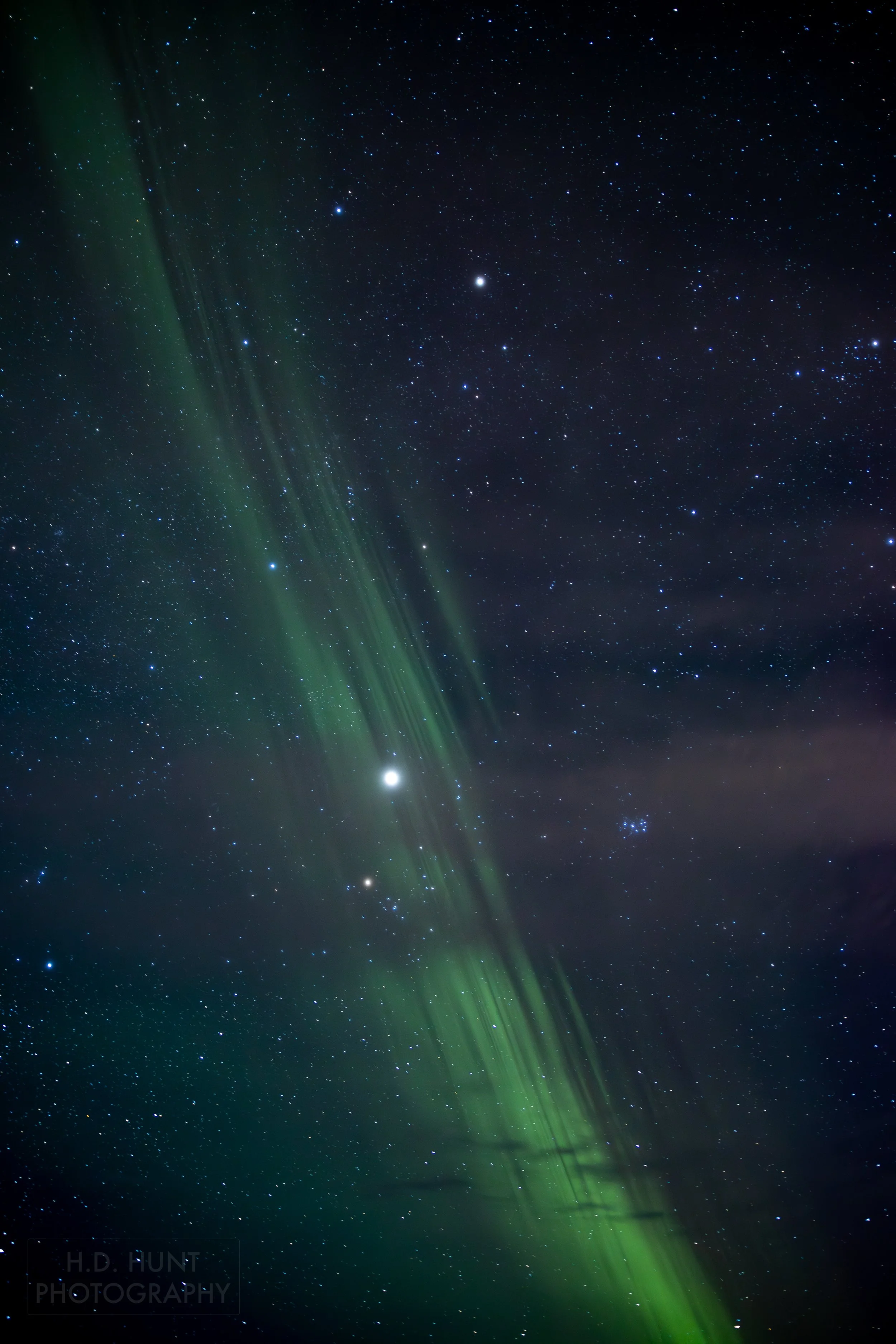 The green light of Aurora Borealis - the Northern Lights - is seen north of Grindavik on the Reykjanes Peninsula, Iceland.