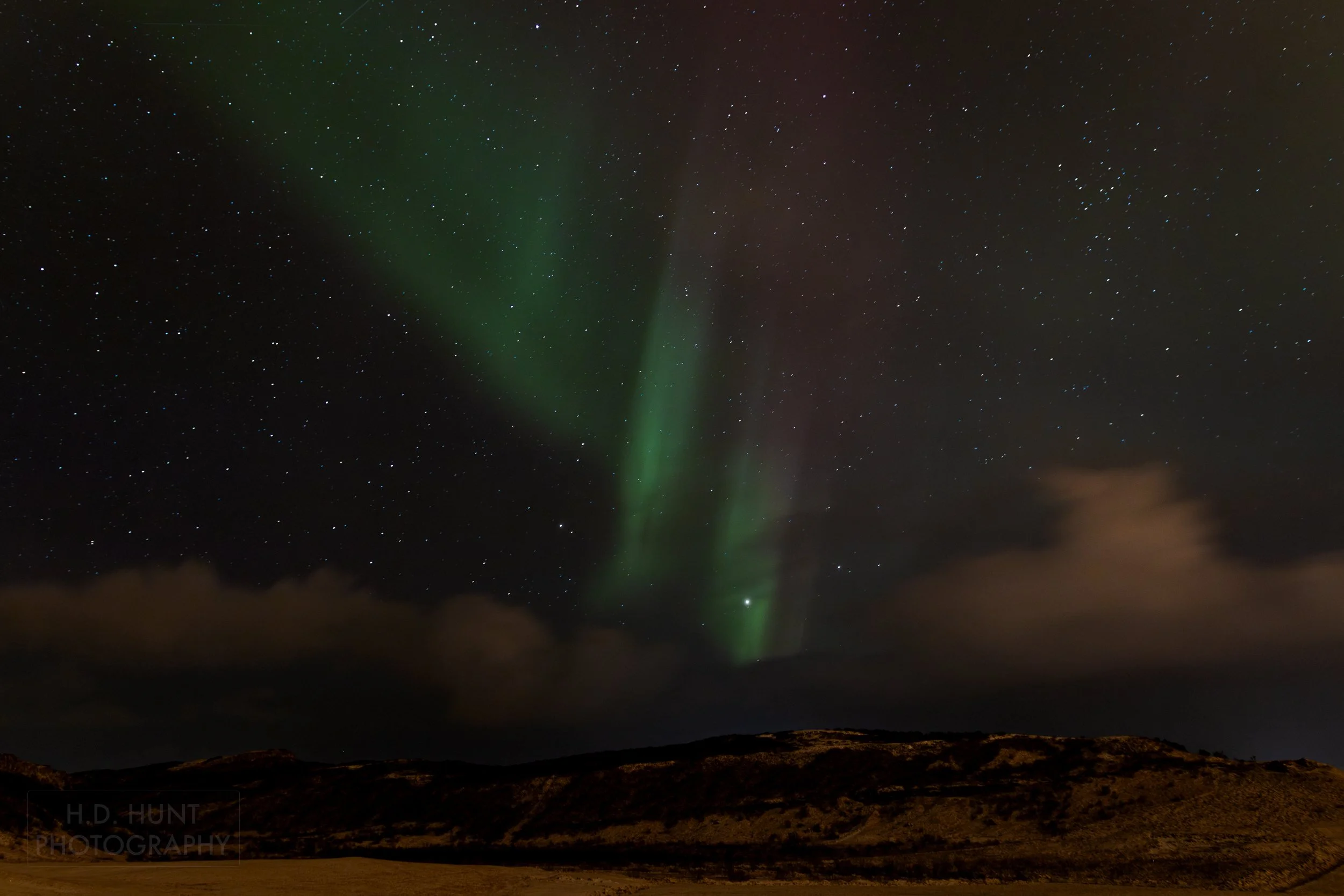 The green light of Aurora Borealis - the Northern Lights - is seen north of Reykholt í Biskupstungum, Iceland.