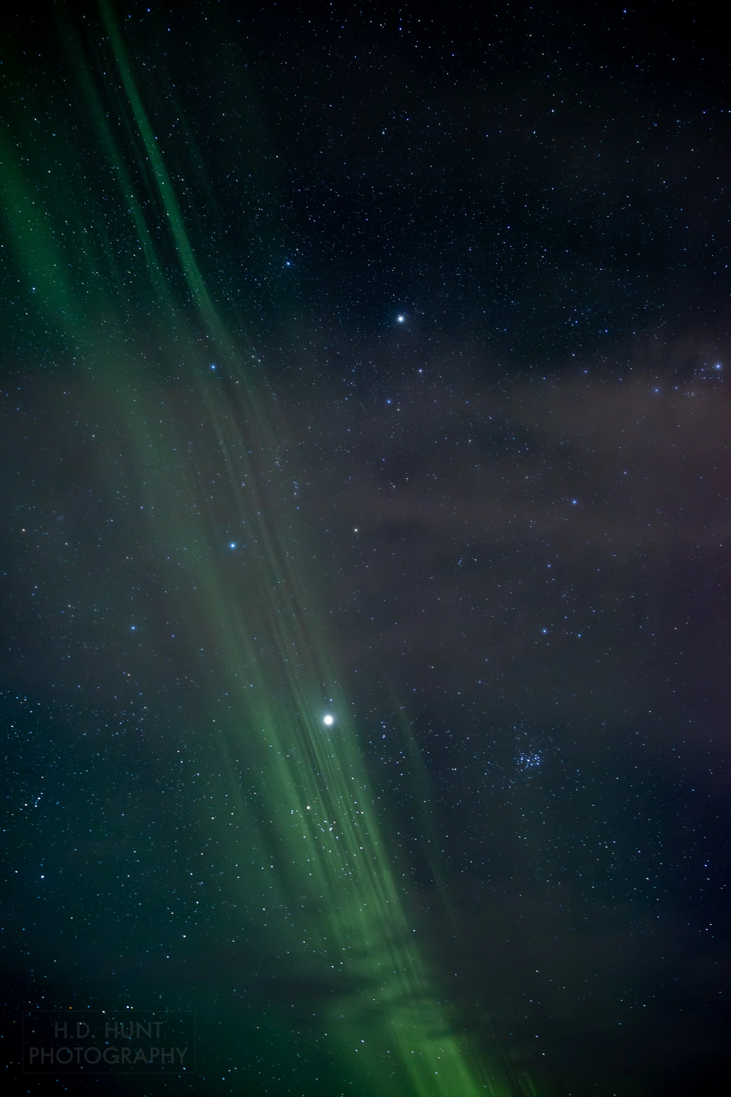 The green light of Aurora Borealis - the Northern Lights - is seen north of Grindavik on the Reykjanes Peninsula, Iceland.